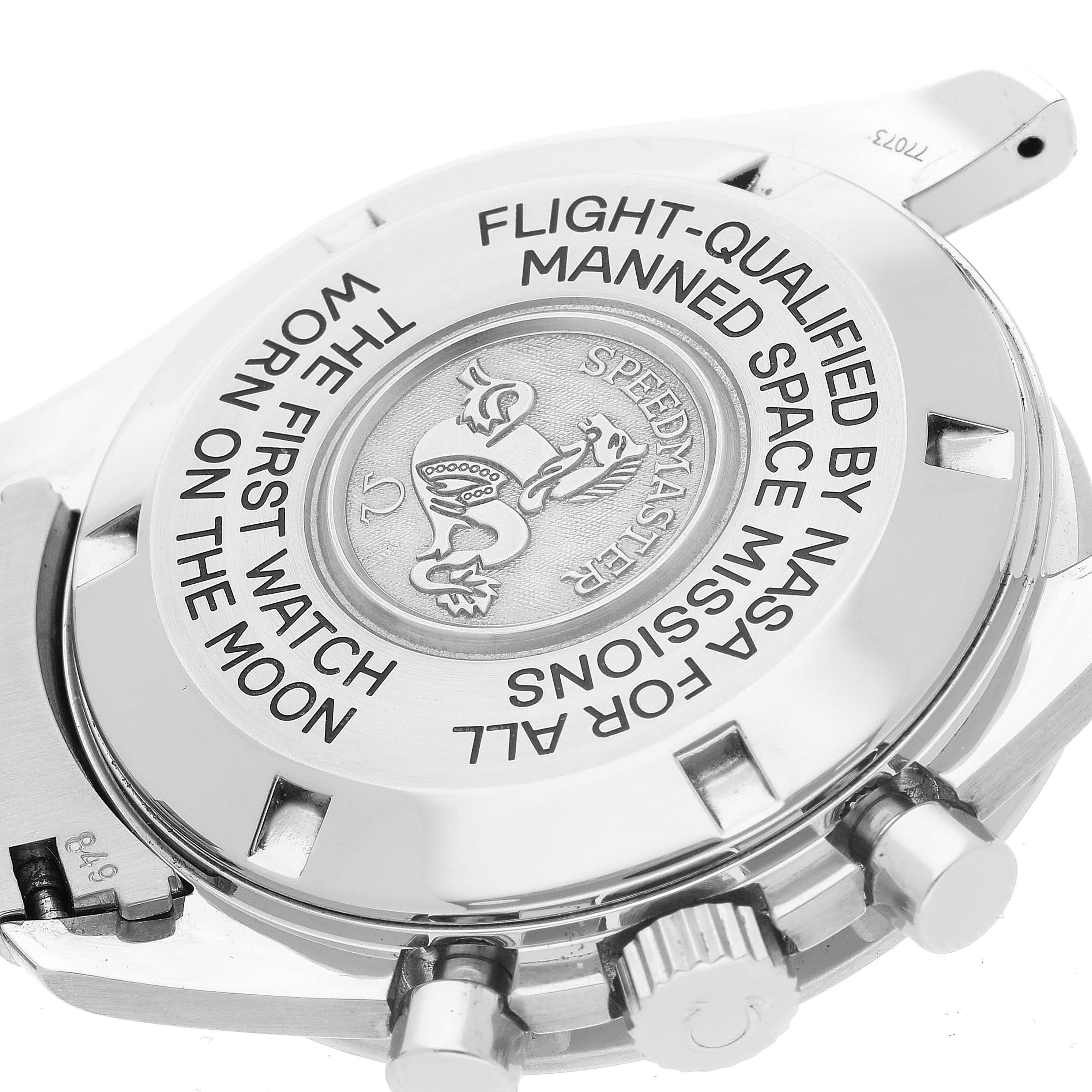 The image shows the back casing of the Omega Speedmaster 3575.20.00 Men's Stainless Steel White Dial 3575.20.00 Men's Stainless Steel White Dial watch, featuring engravings and the crown with pushers.