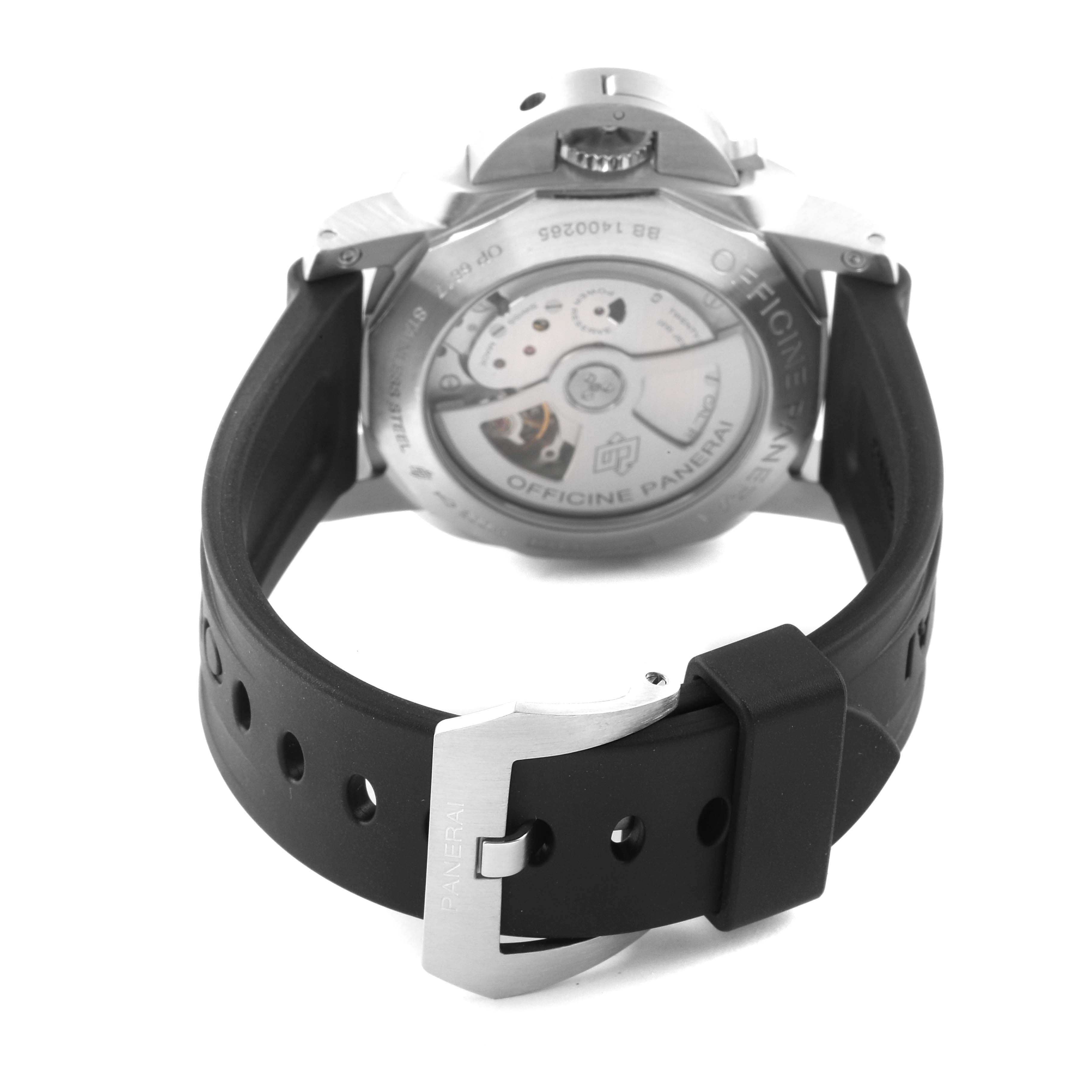 The image shows the back view of a Panerai Luminor PAM00320 Men
s Stainless Steel Black Dial PAM00320 Men
s Stainless Steel Black Dial watch, highlighting its case back, movement, and rubber strap with buckle.
