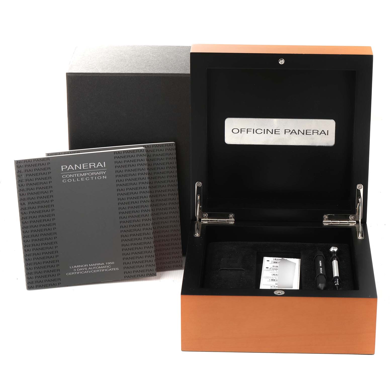 This image shows the open display box, manual, and accessories for a Panerai Luminor PAM00312 Men
s Stainless Steel Black Dial PAM00312 Men
s Stainless Steel Black Dial watch.