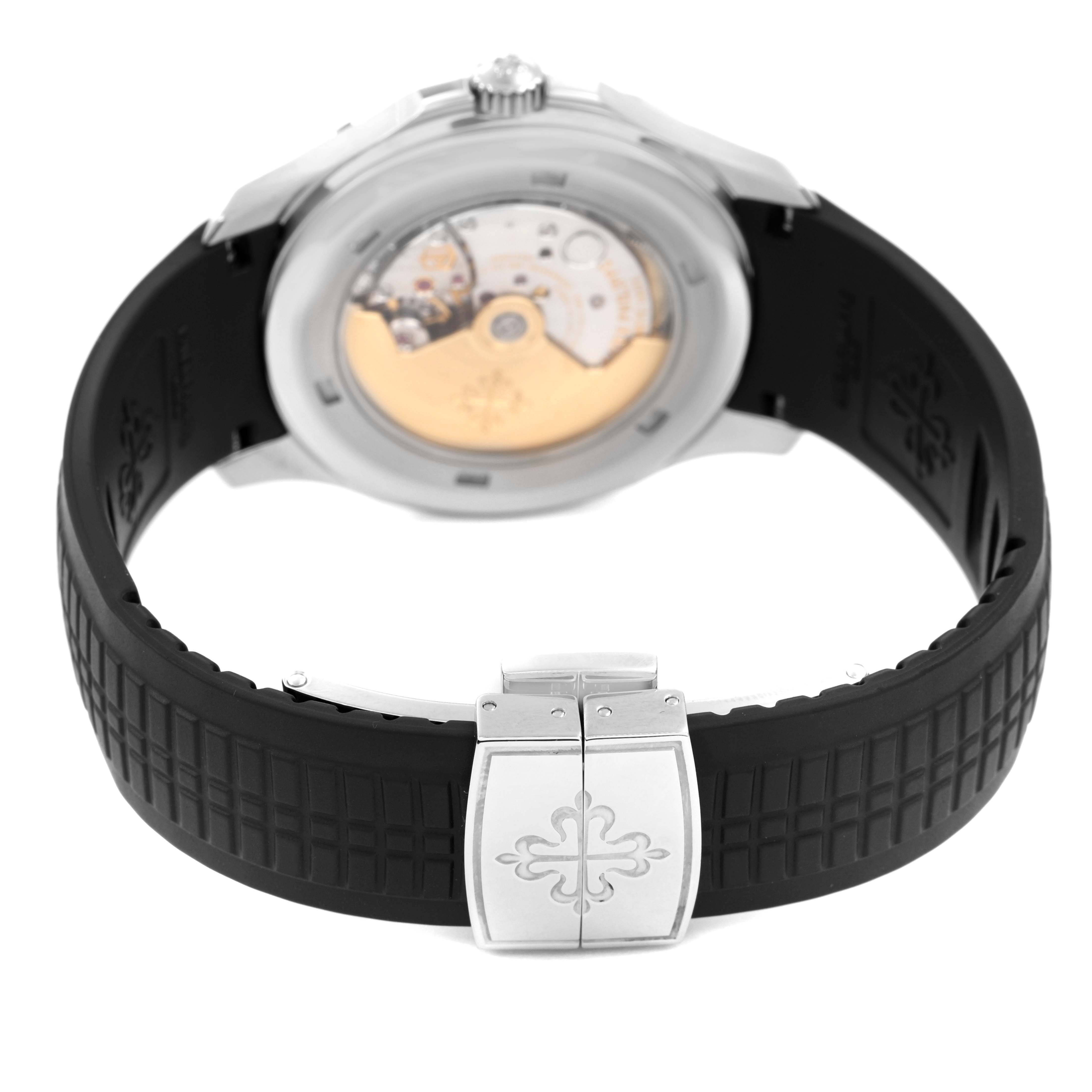 The Patek Philippe Aquanaut 5167A-001 Men's Stainless Steel Grey Dial watch is shown from the back, highlighting its movement, case back, and rubber strap with clasp.