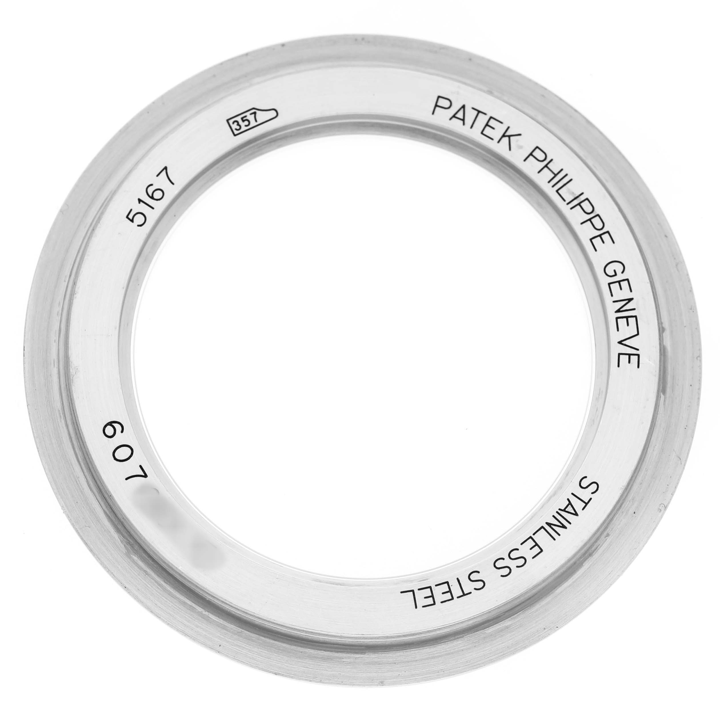 This image shows the bezel for a Patek Philippe Aquanaut 5167A-001 Men's Stainless Steel Grey Dial, featuring engraved markings viewed from the top.