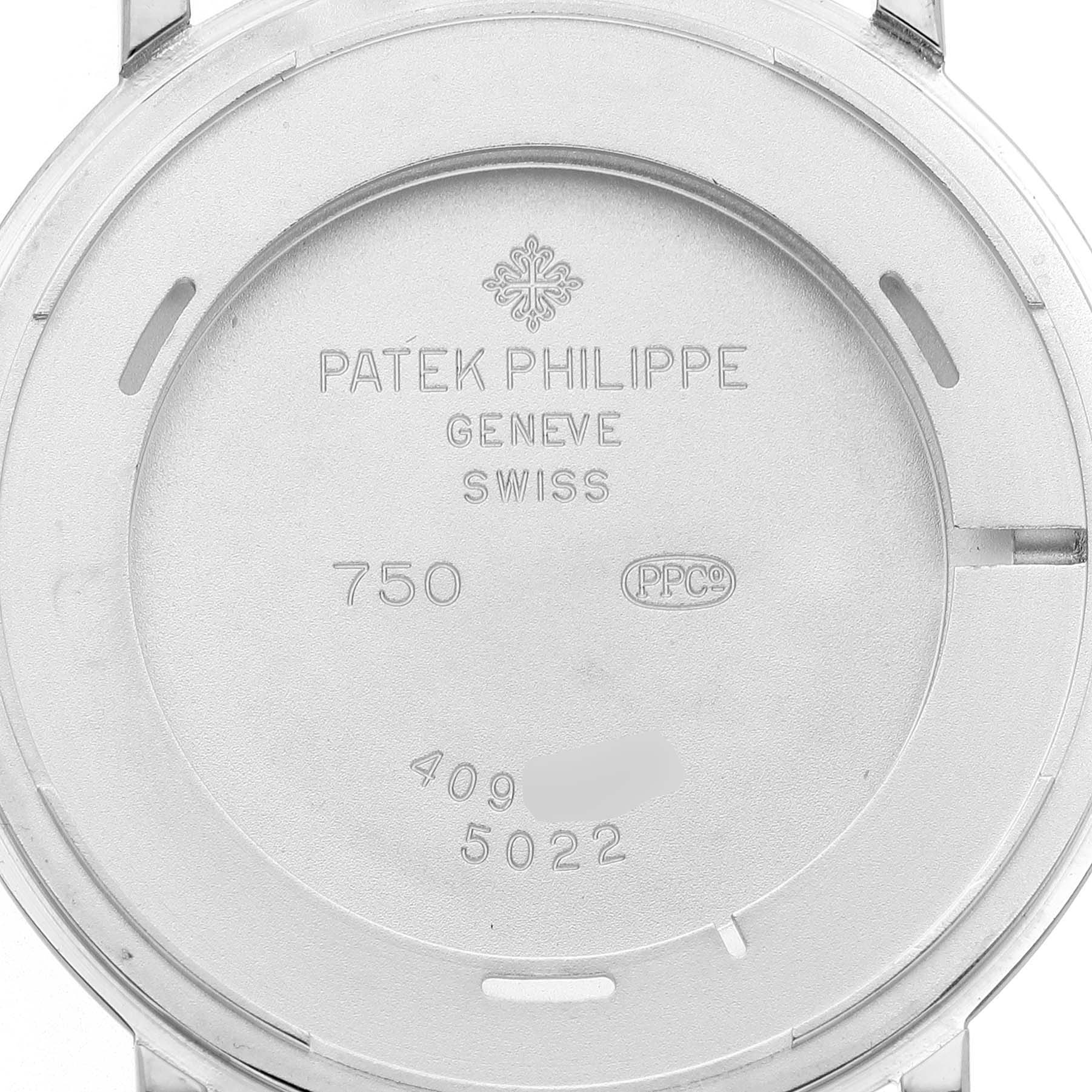 The image shows the back casing of a Patek Philippe Calatrava 83323 Men's White Gold White Dial watch, highlighting the engravings and markings.
