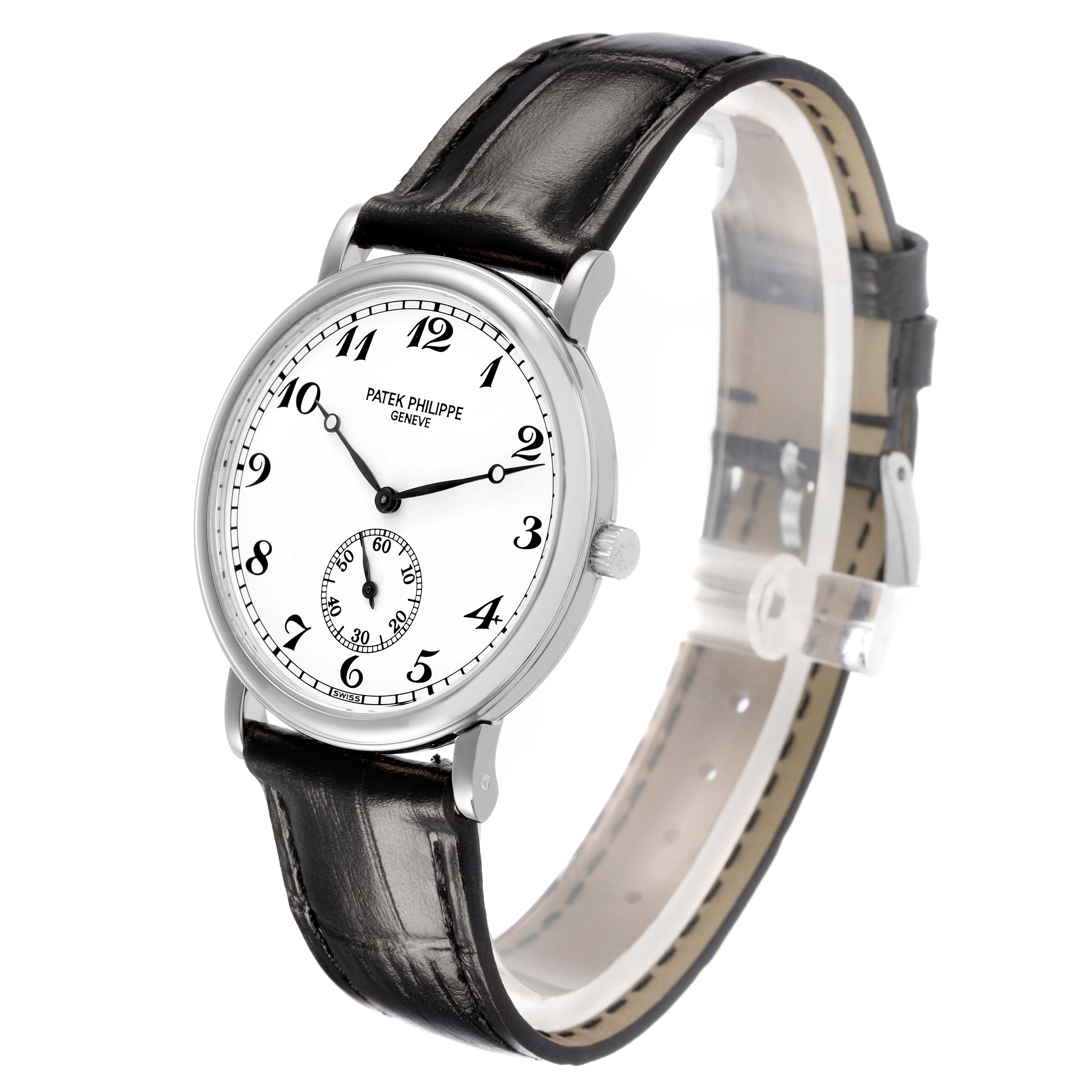 The Patek Philippe Calatrava 83323 Men's White Gold White Dial watch is shown at an angled side view, highlighting the dial, case, crown, and leather strap.