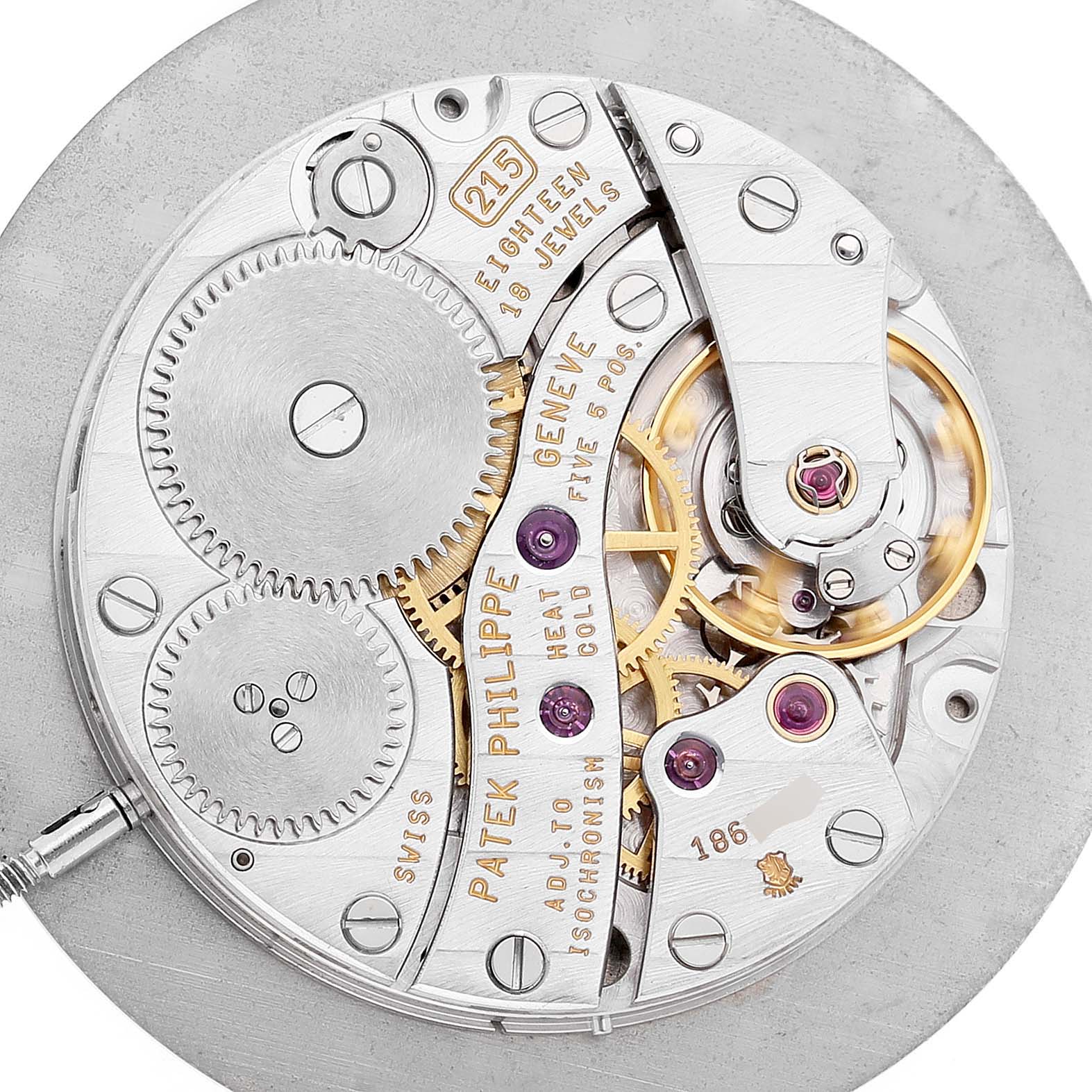 This image shows the movement of the Patek Philippe Calatrava 83323 Men's White Gold White Dial, highlighting gears and jewels from a top-down angle.