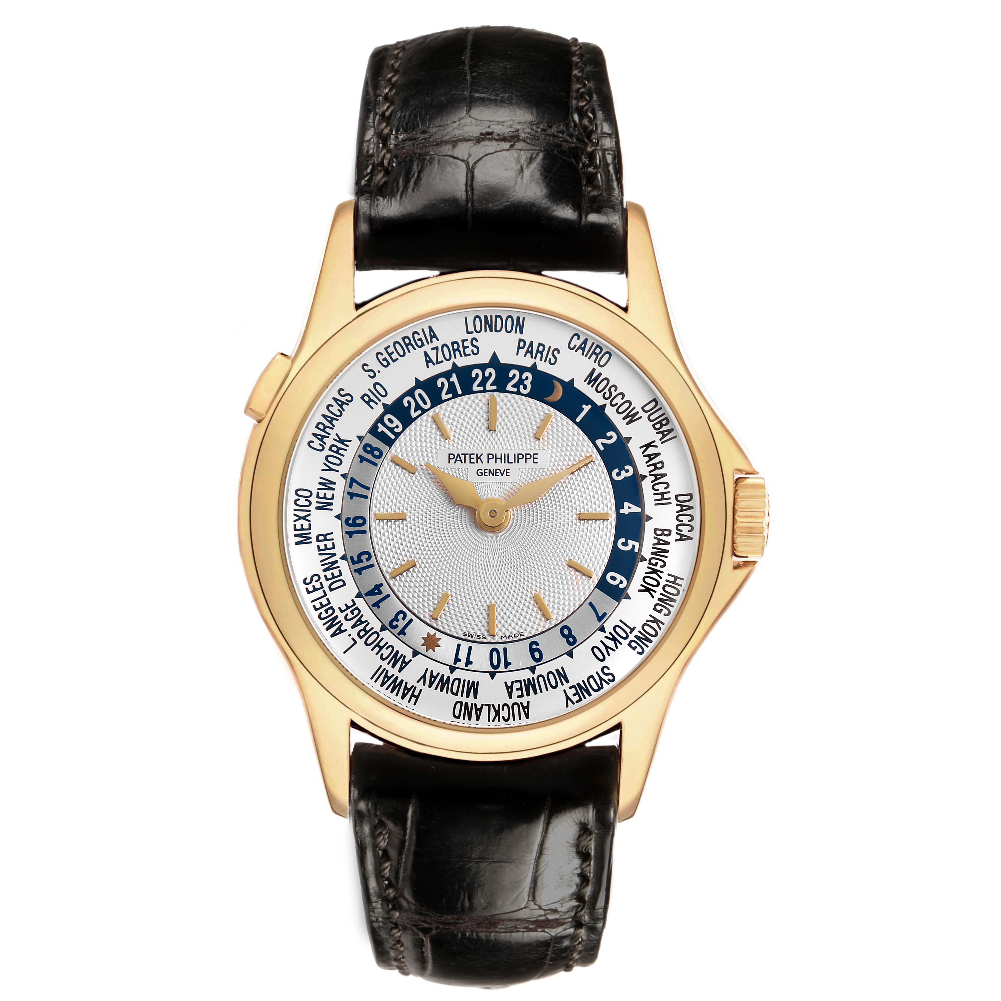 The Patek Philippe Complications 5110J-001 Men's Yellow Gold Silver Dial watch is shown from a top-down angle, displaying its dial with world time indicators and leather strap.