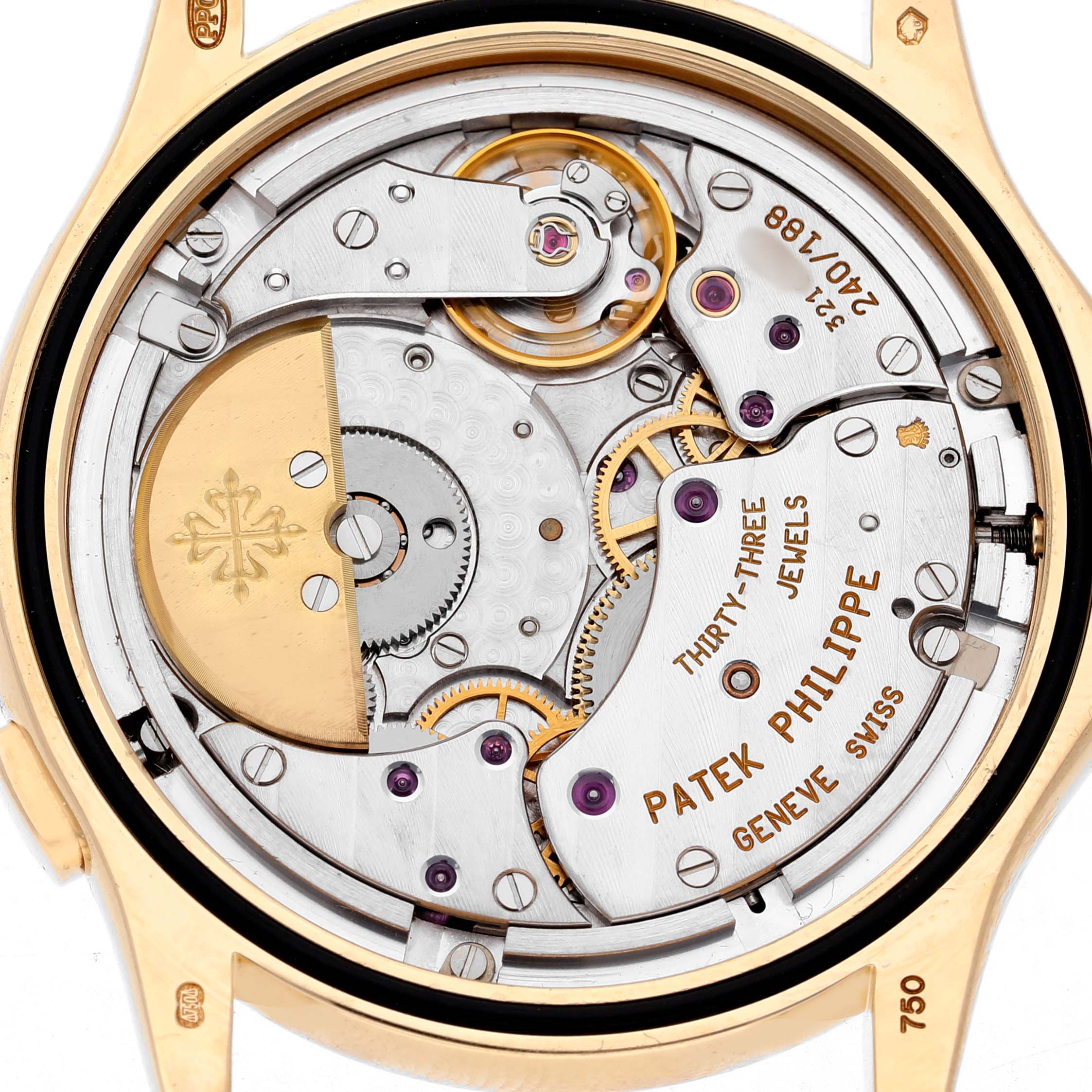 The image shows the back view of a Patek Philippe Complications 5110J-001 Men's Yellow Gold Silver Dial watch, highlighting its intricate movement and mechanical parts.