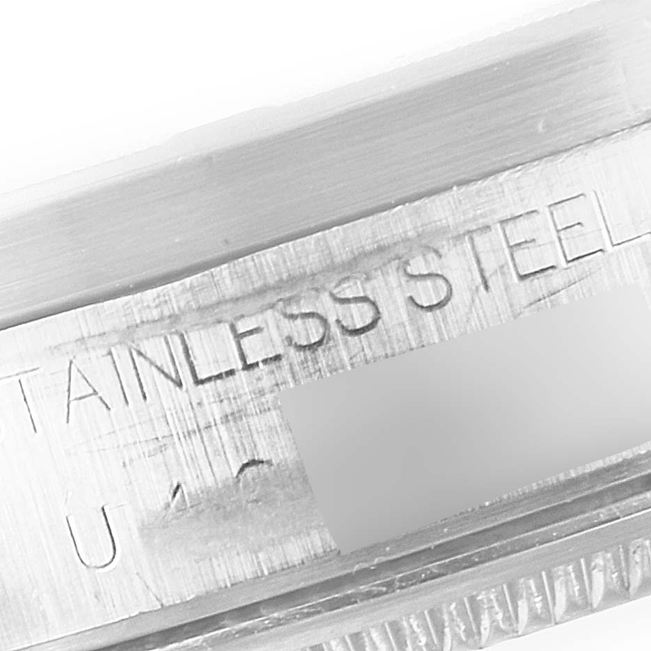 This image shows a close-up of the side engraving on a stainless steel case of a Rolex Air-King 14010 Men's Stainless Steel Silver Dial 14010 Men's Stainless Steel Silver Dial watch.