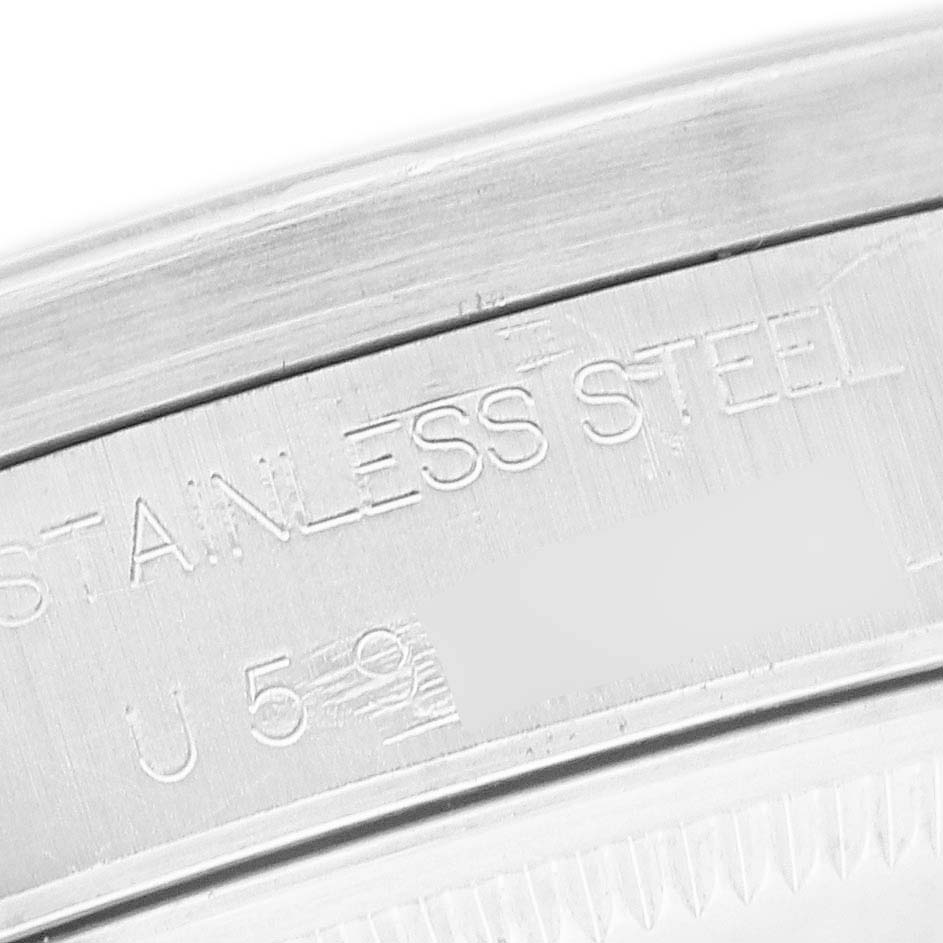 The image shows a close-up of the inner engraving on the bezel of a Rolex Air-King 14010 Men's Stainless Steel Black Dial watch, highlighting "Stainless Steel" text.