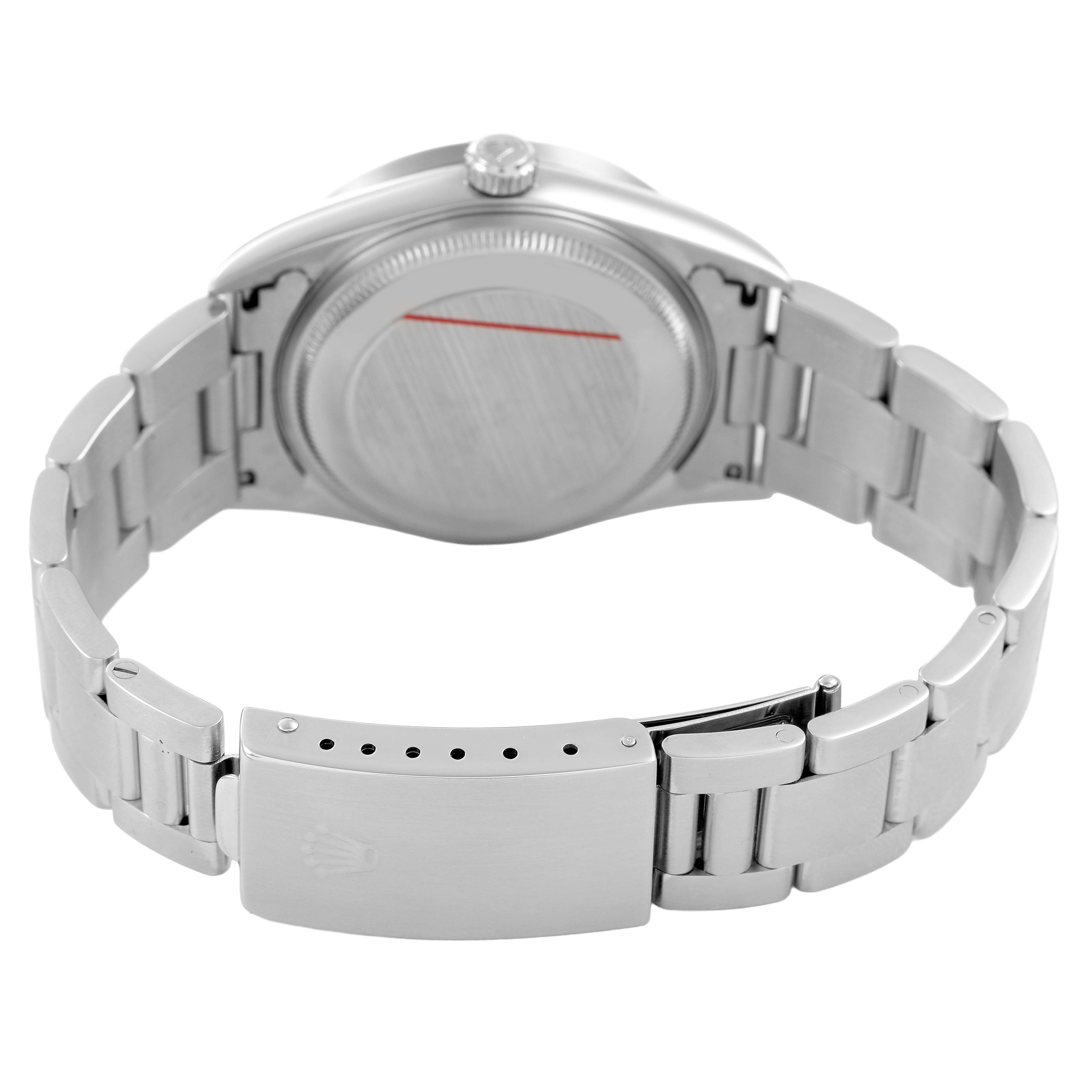 The image shows the back view of a Rolex Air-King 14010 Men's Stainless Steel Black Dial watch, highlighting its case back and partially open bracelet with clasp.