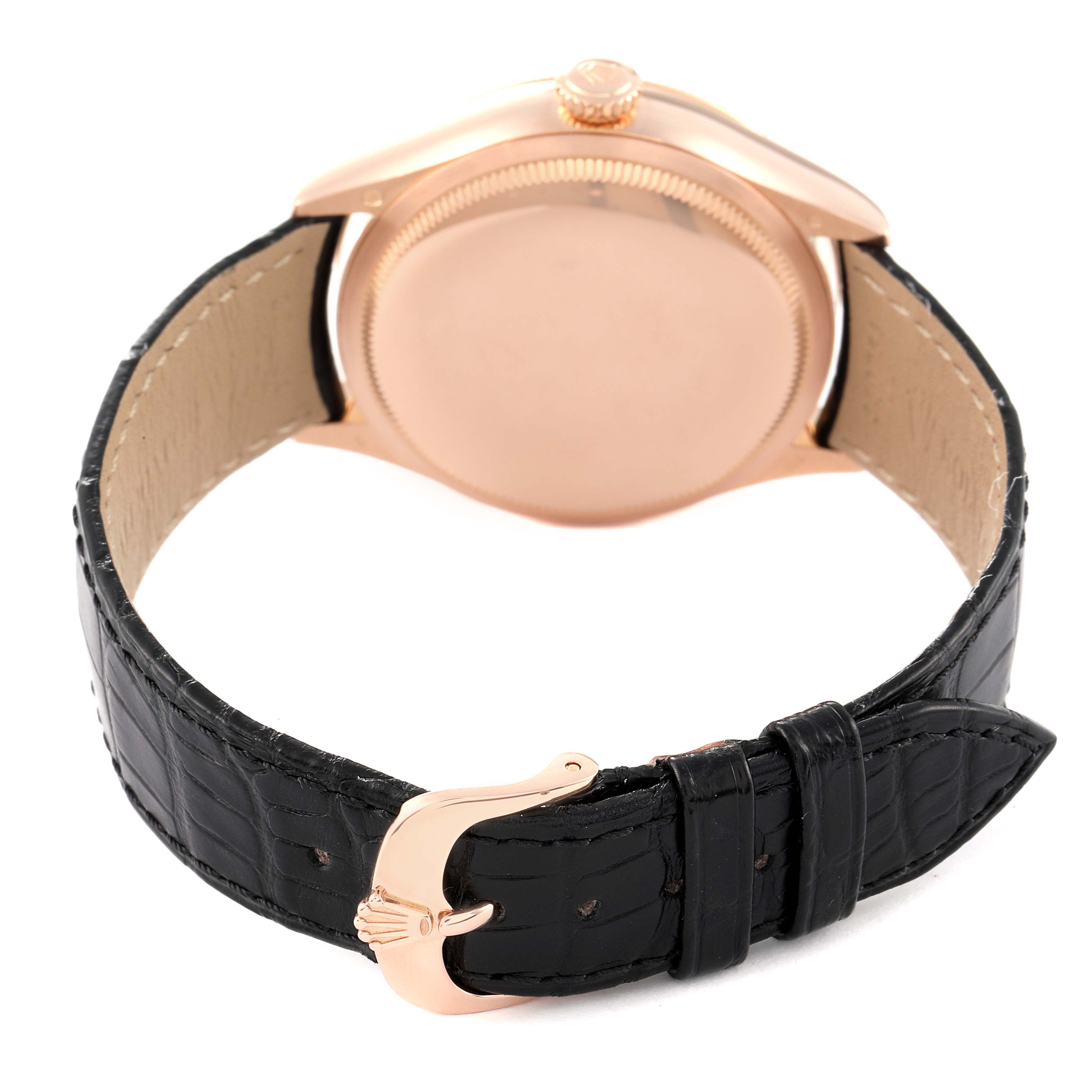 The image shows the back of a Rolex Cellini 50515 Men's Rose Gold Silver Dial 50515 Men's Rose Gold Silver Dial watch with a black leather strap and gold clasp.