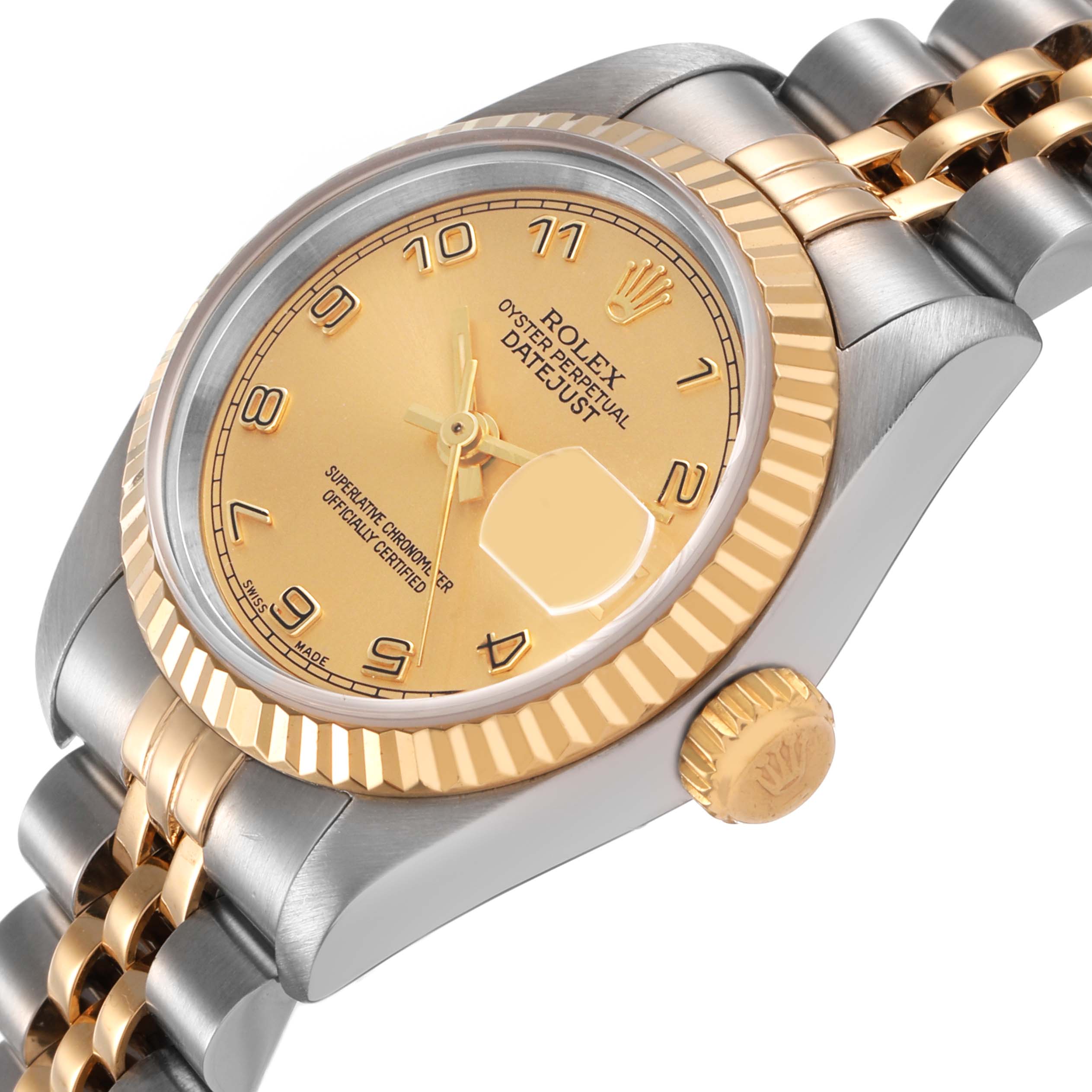 The Rolex Datejust 69173 Women's Stainless Steel Champagne Dial is shown at a three-quarter angle, highlighting the gold bezel, crown, and stainless steel and gold bracelet.