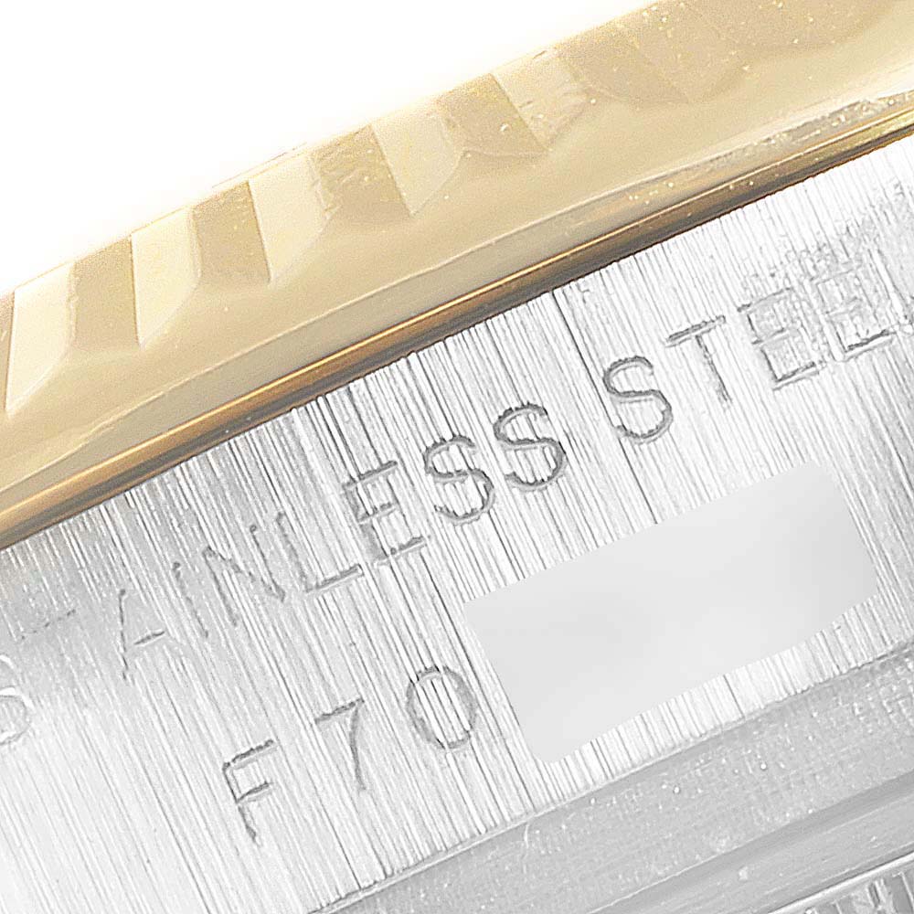 Close-up of the edge of the bezel and serial number area of a Rolex Datejust 179173 Women
s Steel and Gold (two tone) Champagne Dial 179173 Women
s Steel and Gold (two tone) Champagne Dial watch.