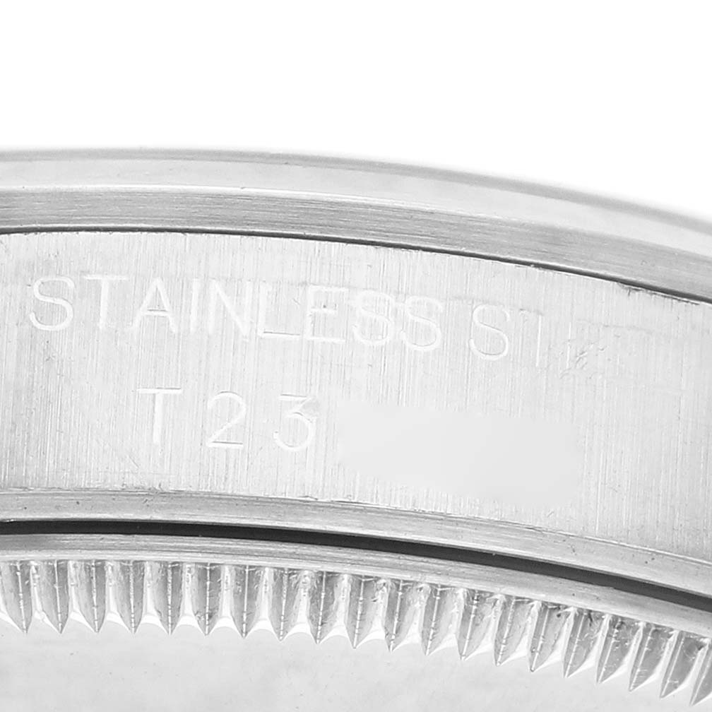 The image shows a close-up of the bezel edge and serial information on a stainless steel Rolex Mid-Size 68240 Women's Stainless Steel Pink Dial watch.