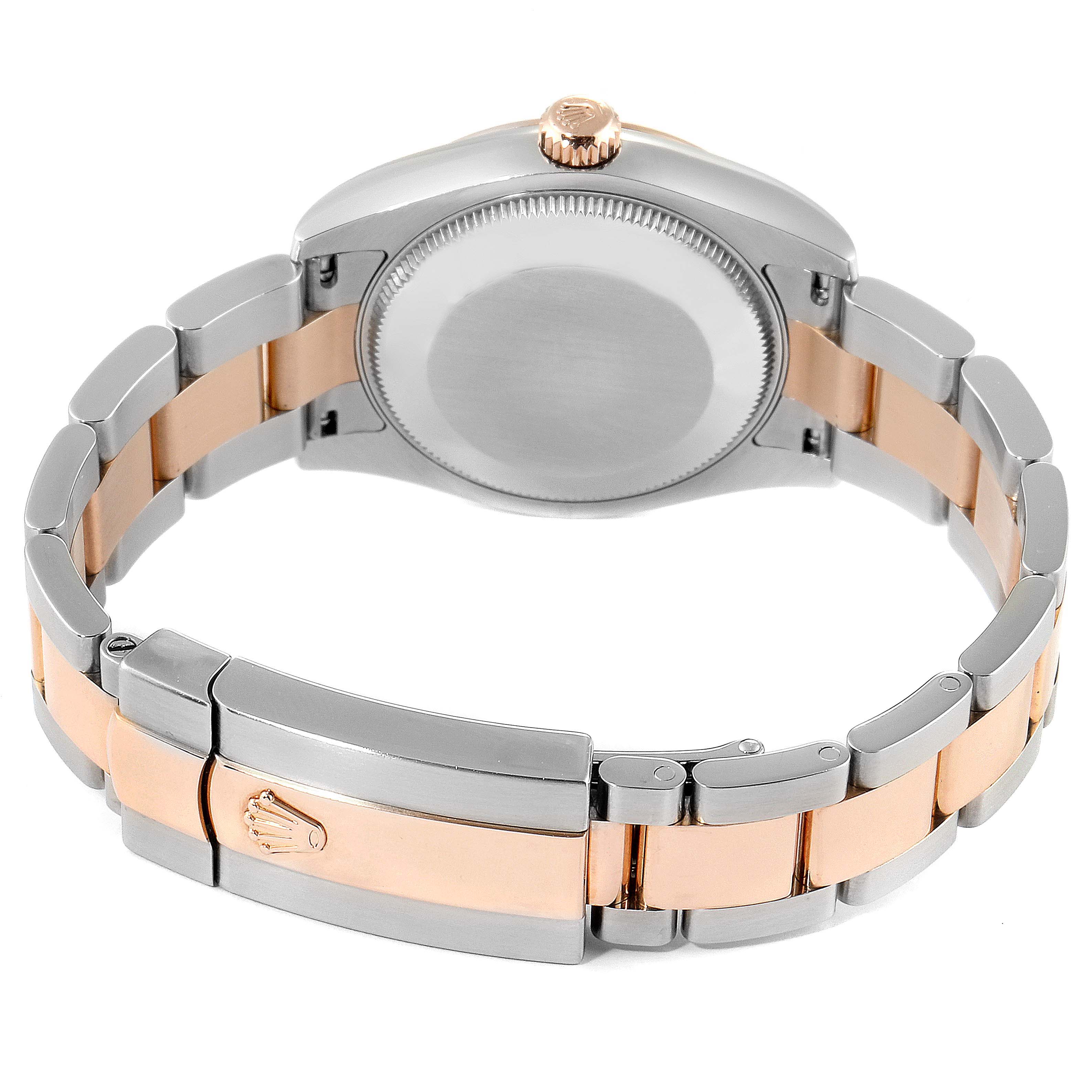 This image shows the back view of a Mid-Size Rolex watch, including its bracelet, clasp, and case back.