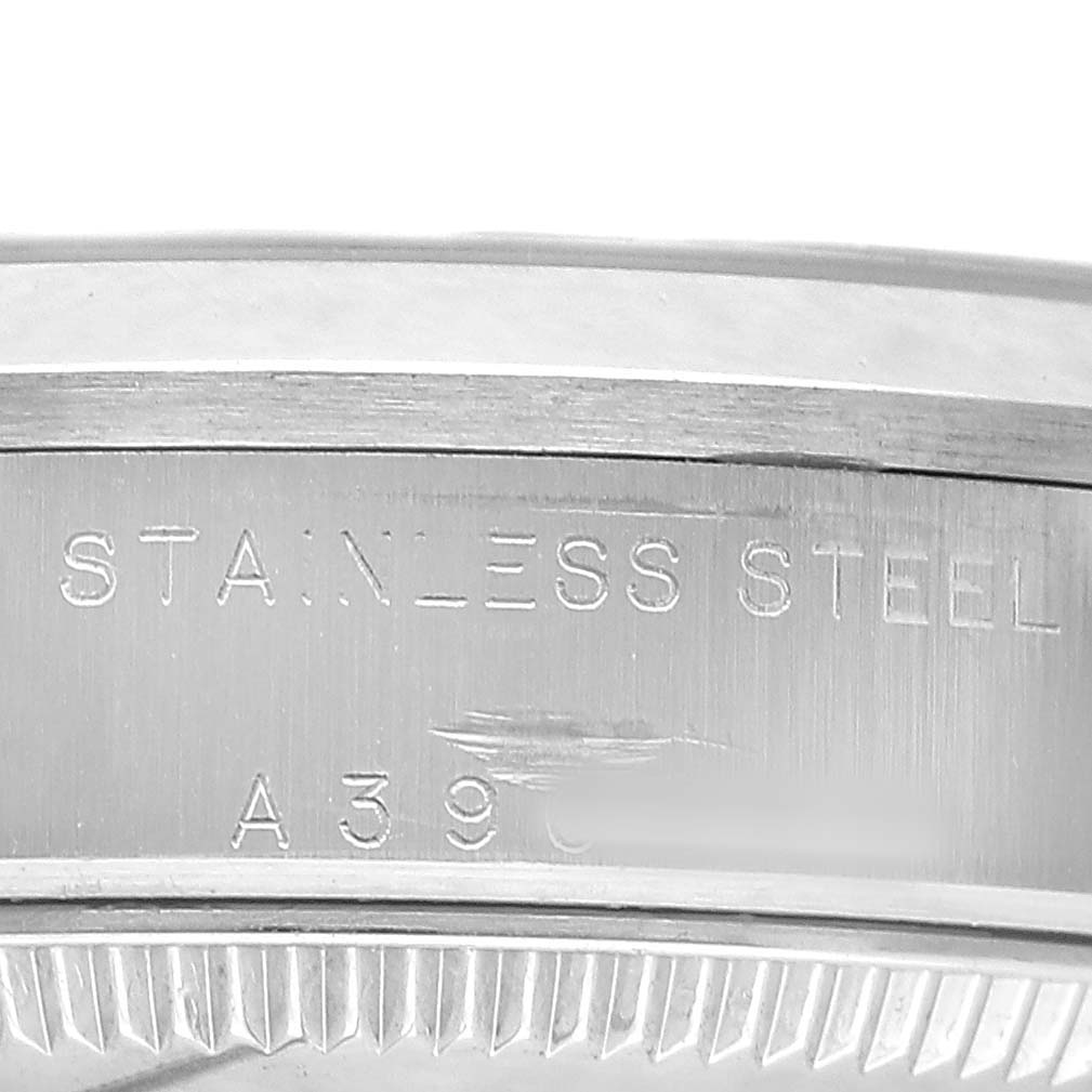The image shows a close-up of the side of a Rolex Datejust 78240 Women's Stainless Steel Silver Dial watch case, highlighting the stainless steel engraving.