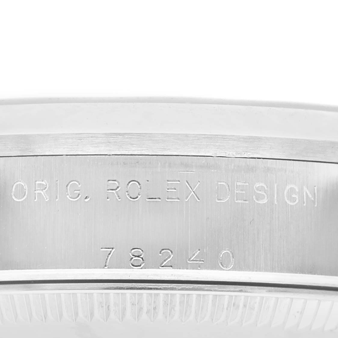 The image shows the side view of the Rolex Datejust 78240 Women's Stainless Steel Silver Dial, focusing on the engraved bezel inscription.