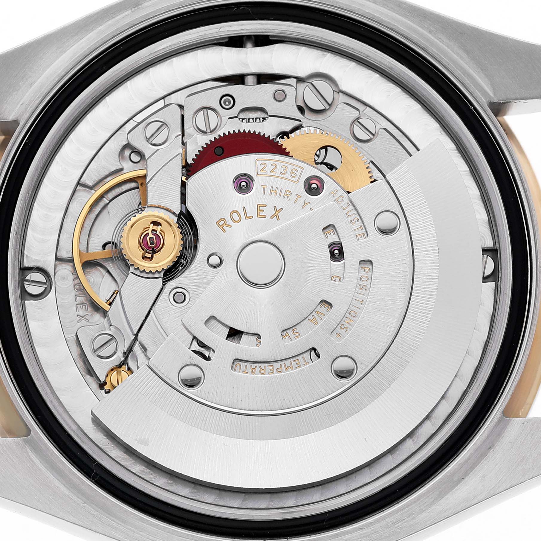 The image shows the detailed movement of a Rolex Mid-Size 278383 Women's Steel and Gold (two tone) Mother of Pearl Dial model watch from a back angle.