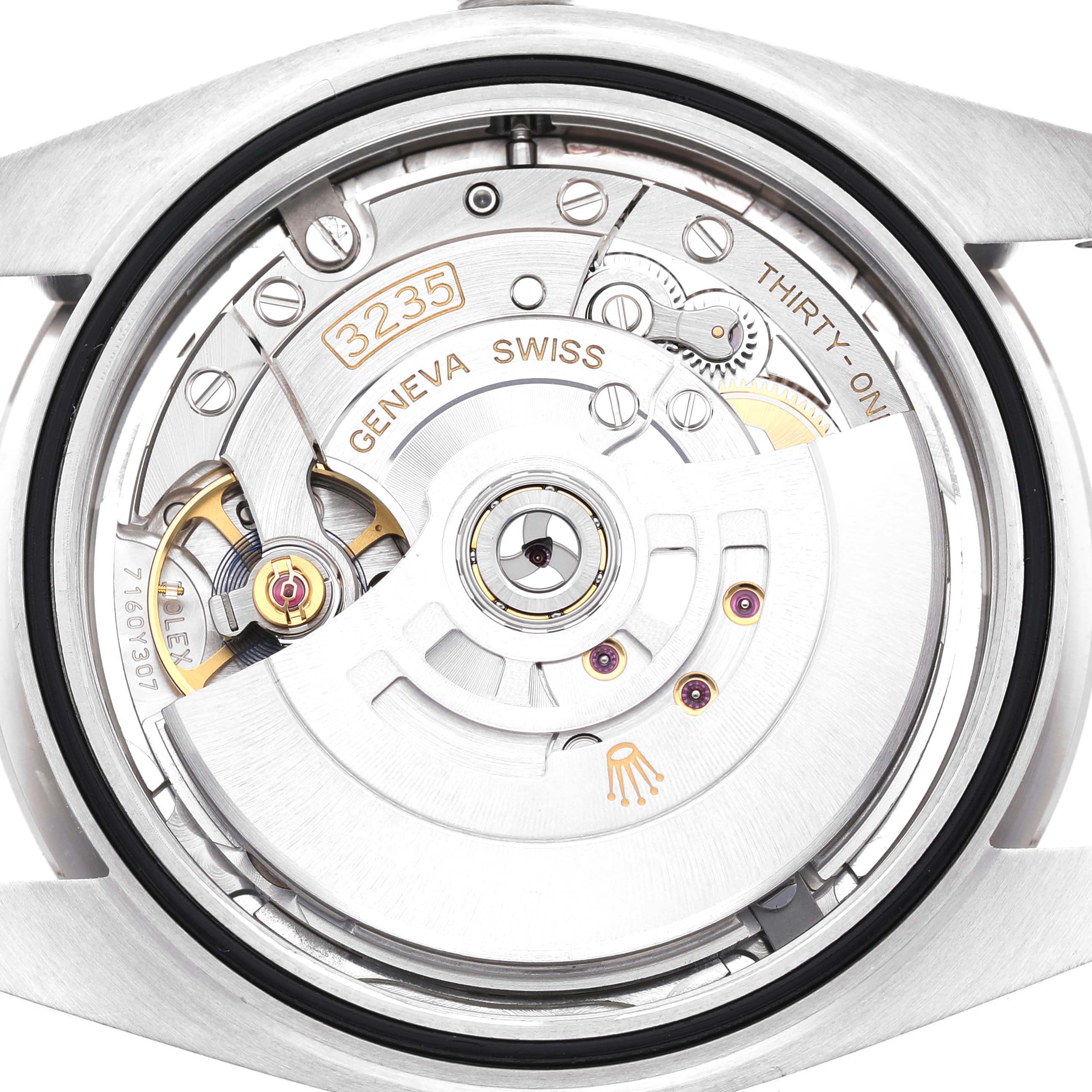 The image shows the back view of the Rolex Datejust 41 126334 Men's Stainless Steel Silver Dial, focusing on the movement and inner mechanisms.
