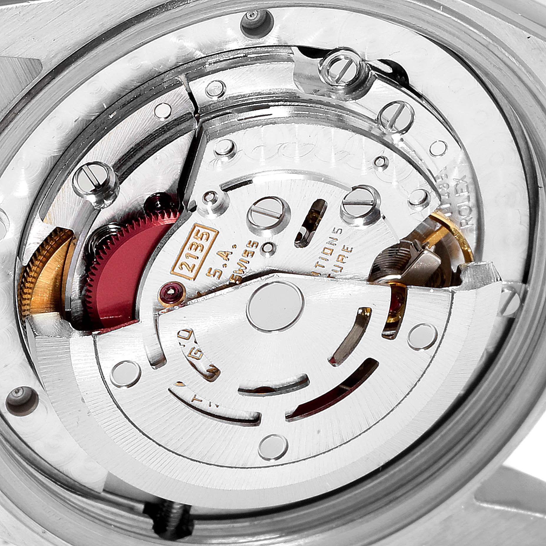 This image shows the internal mechanism of the mid-size Rolex watch taken from the back, highlighting its intricate components.