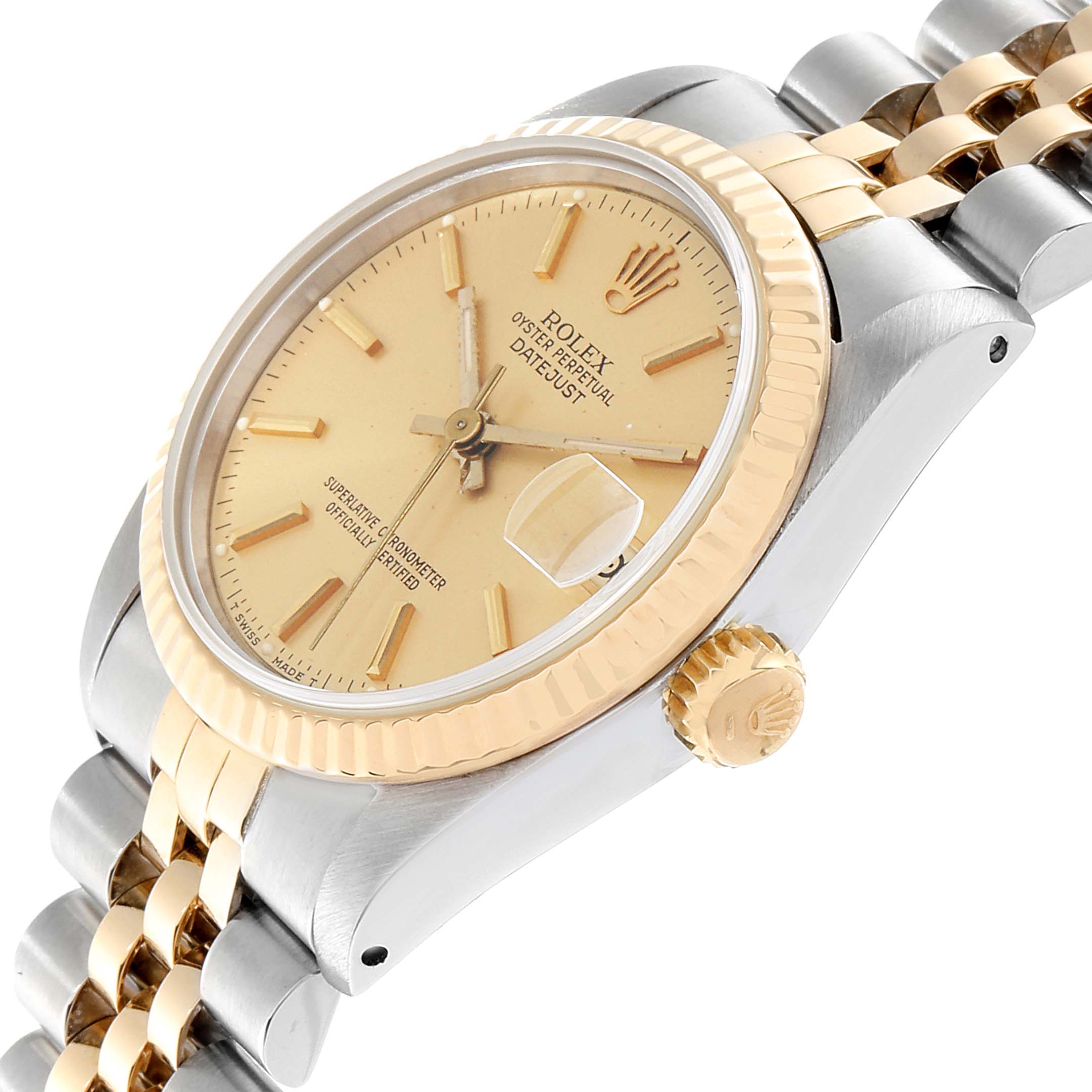 This image shows a near-side angle of the Rolex Mid-Size 68273 Women
s Steel and Gold (two tone) Champagne Dial 68273 Women
s Steel and Gold (two tone) Champagne Dial Datejust, highlighting its gold bezel, dial, and two-tone bracelet.