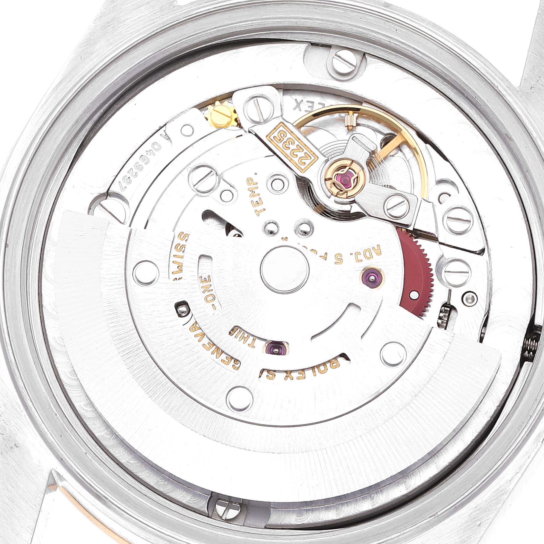 The image shows the intricate inner mechanism and movement of a Rolex Mid-Size 78273 Women
s Steel and Gold (two tone) Champagne Dial 78273 Women
s Steel and Gold (two tone) Champagne Dial model watch from a close-up angle.