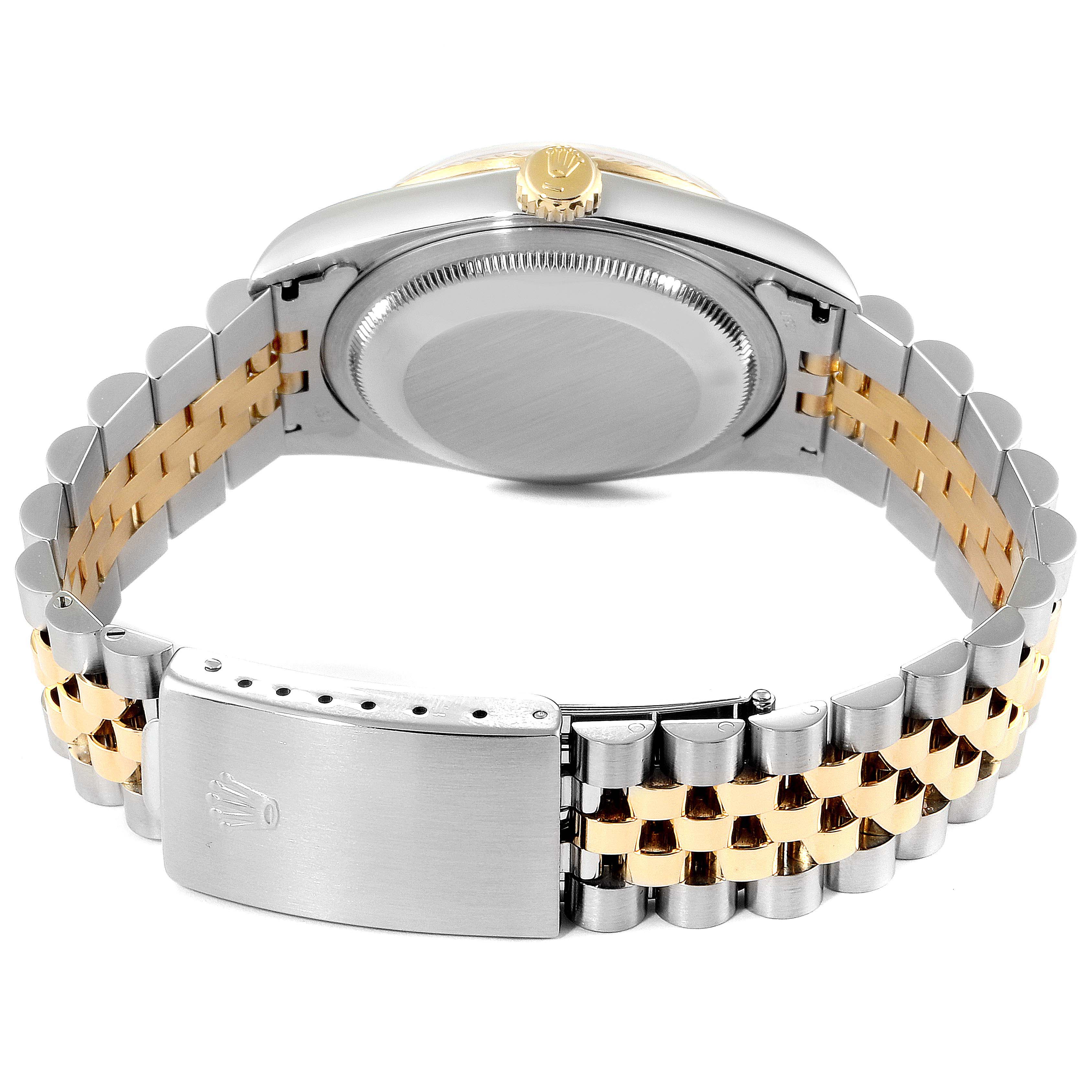 This image shows the back of the Rolex Datejust 16233 Men
s Steel and Gold (two tone) Champagne Dial 16233 Men
s Steel and Gold (two tone) Champagne Dial watch, including the case back, crown, and the two-tone jubilee bracelet with clasp.