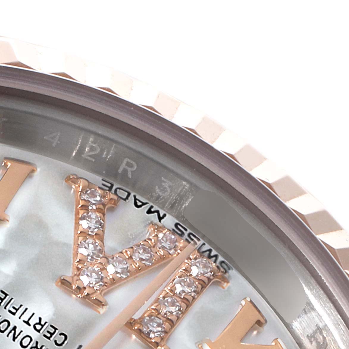 The image shows a close-up of the Rolex Datejust 179171 Women's Steel and Gold (two tone) Mother of Pearl Dial 179171 Women's Steel and Gold (two tone) Mother of Pearl Dial watch, focusing on the bezel and diamond-set Roman numeral hour markers.