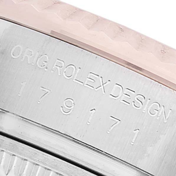 This is a close-up view of the engraved side of the bezel and case of a Rolex Datejust 179171 Women's Steel and Gold (two tone) Mother of Pearl Dial 179171 Women's Steel and Gold (two tone) Mother of Pearl Dial watch, showing the model number and design engraving.