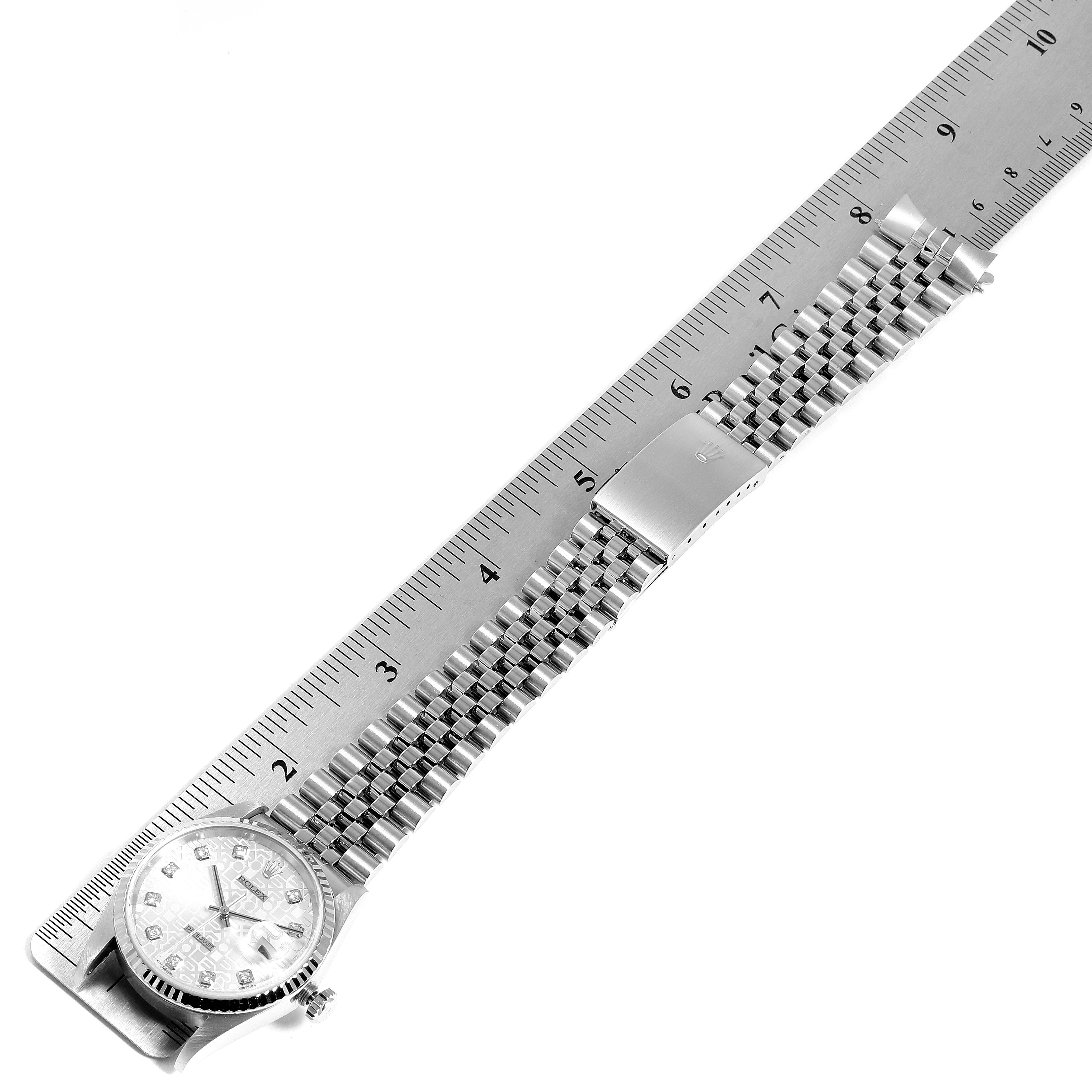 The image shows a Rolex Datejust 16234 Men's Stainless Steel Silver Dial 16234 Men's Stainless Steel Silver Dial watch laid flat with the full bracelet and clasp visible, measured against a ruler.
