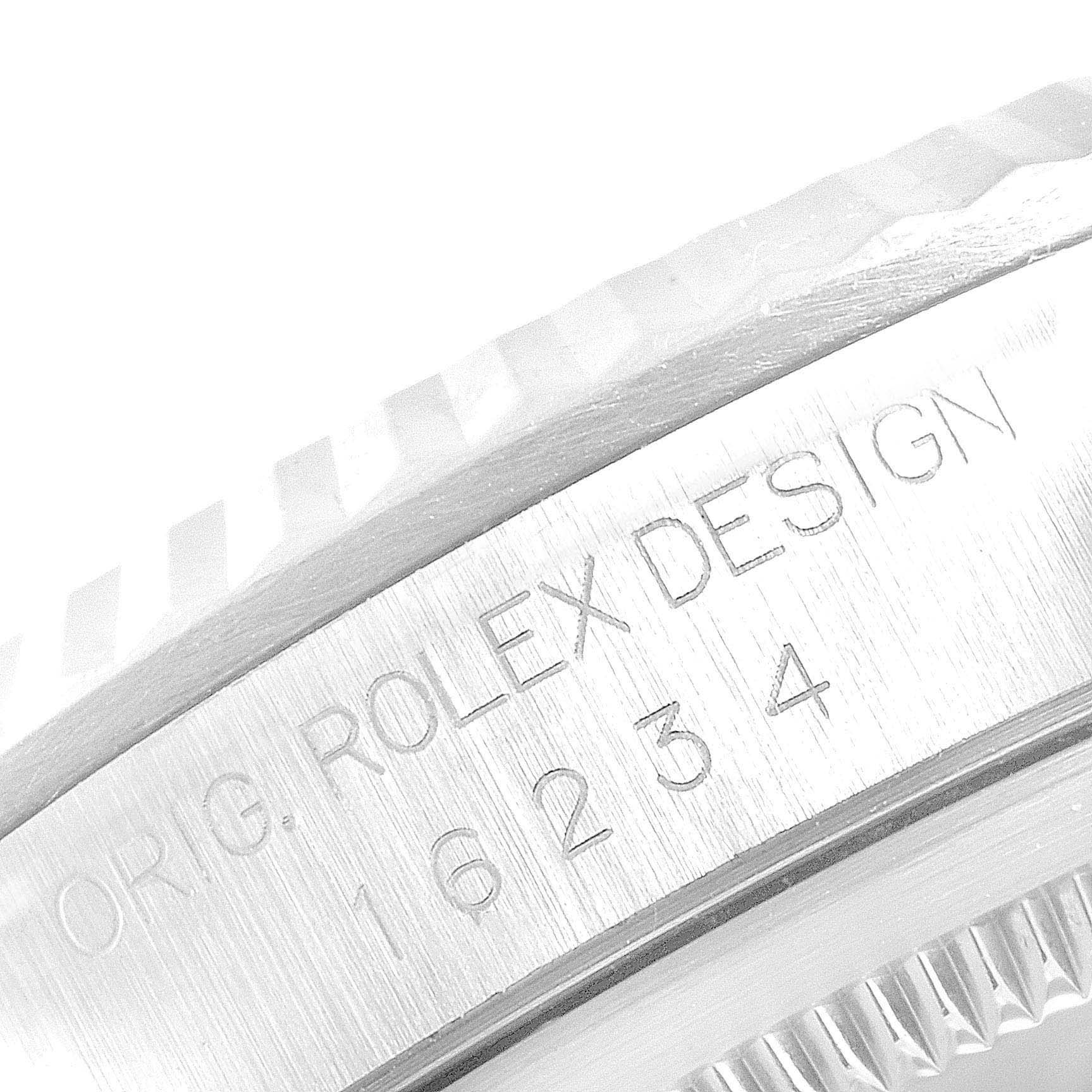 This close-up image shows the side of the bezel and case of a Rolex Datejust 16234 Men's Stainless Steel Silver Dial 16234 Men's Stainless Steel Silver Dial watch, displaying the model number 16234.