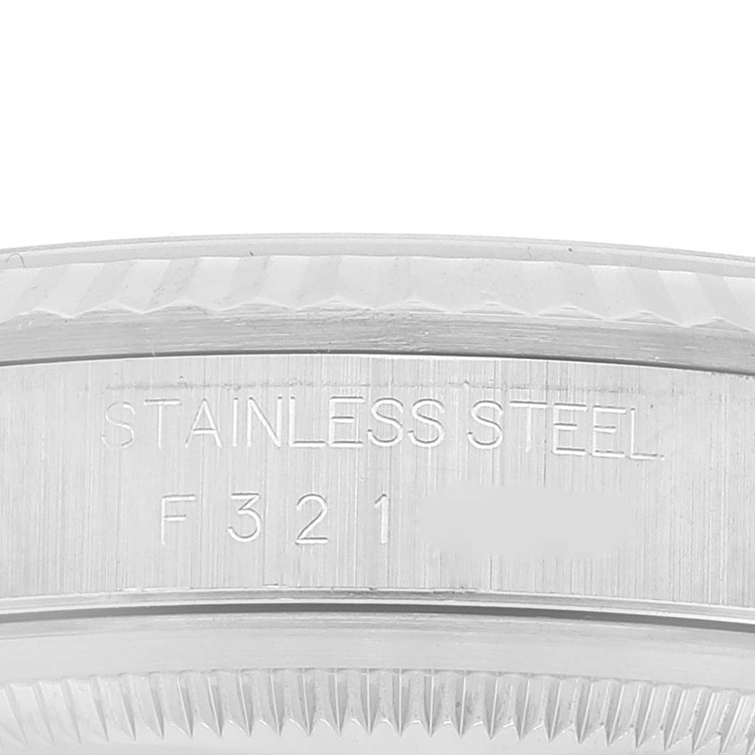 The image shows a close-up of the stainless steel case back of a Rolex Datejust 16234 Men's Stainless Steel Silver Dial 16234 Men's Stainless Steel Silver Dial watch, highlighting the inscription and model number.