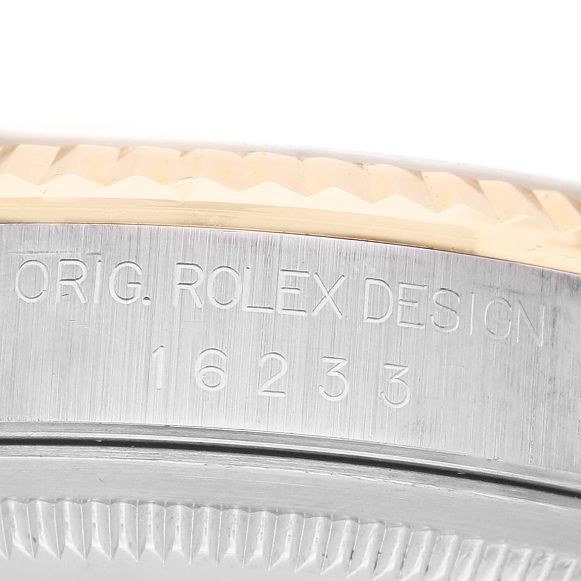 The image shows a close-up of the side of a Rolex Datejust 16233 Women's Steel and Gold (two tone) Silver Dial watch case, highlighting the engraved design and model number "16233".