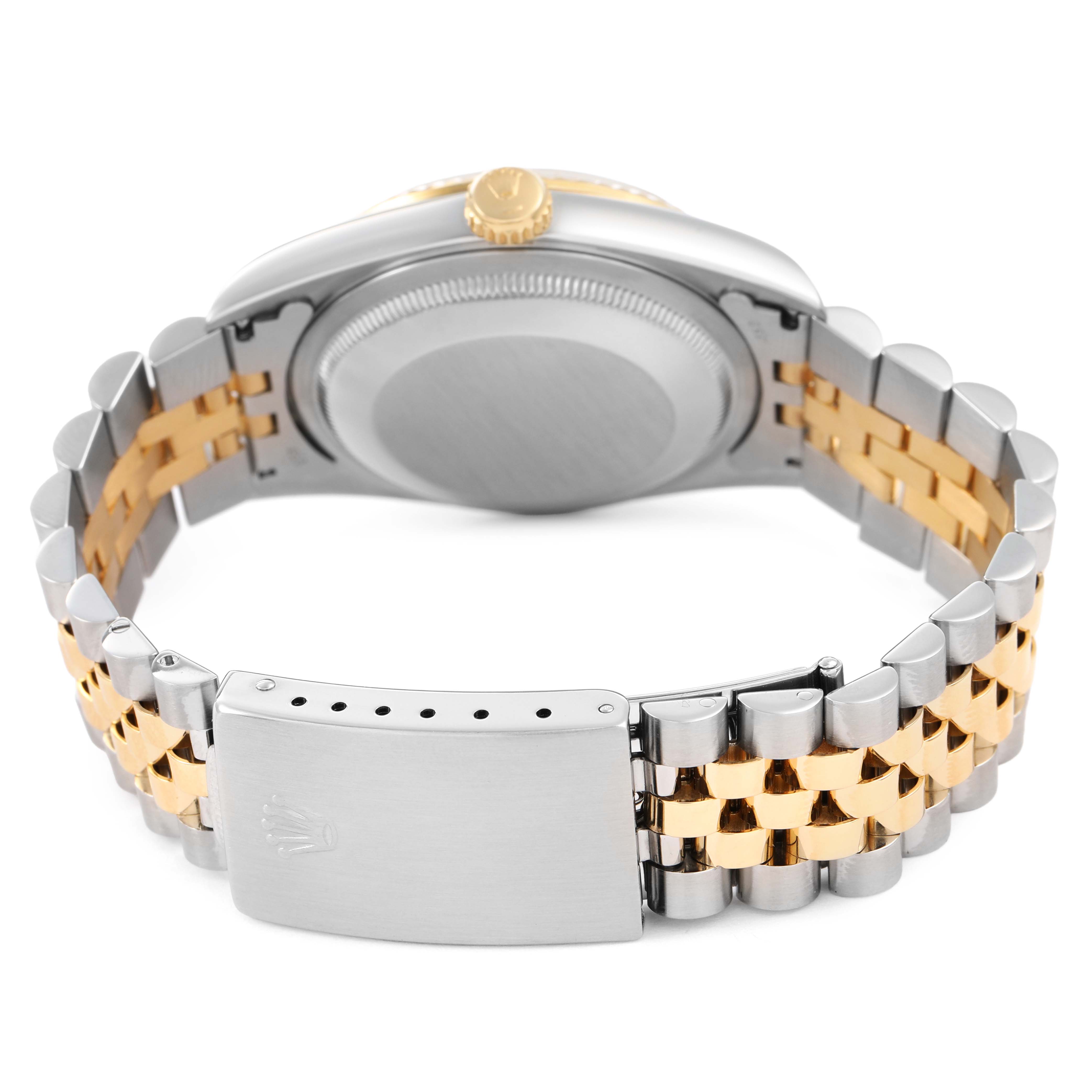 The image shows the back of a Rolex Datejust 16233 Women's Steel and Gold (two tone) Silver Dial with its watch case, crown, and two-tone metal bracelet with a clasp.