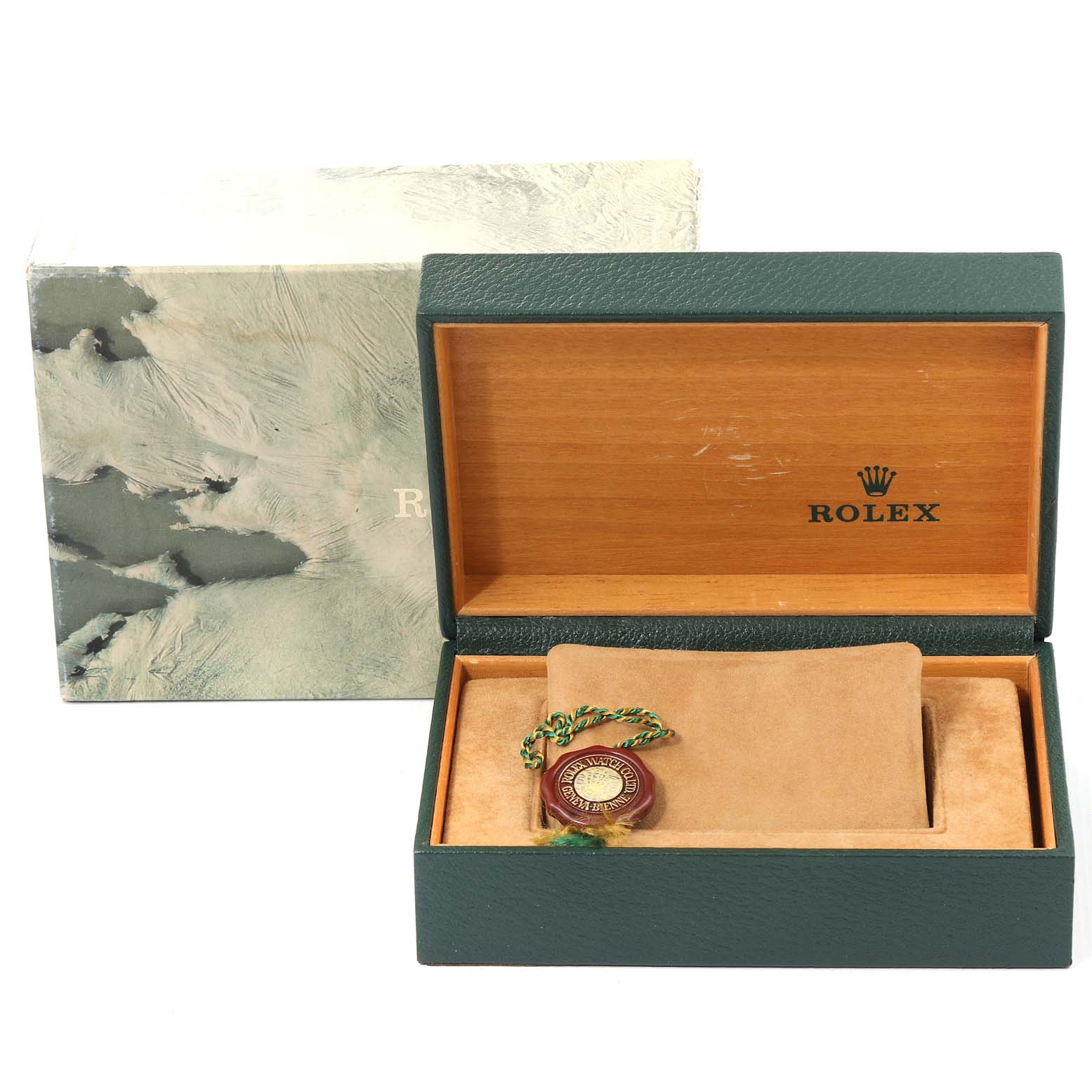 The image shows a Rolex Datejust 16233 Men's Steel and Gold (two tone) Champagne Dial 16233 Men's Steel and Gold (two tone) Champagne Dial packaging box and accessories, including a green and gold seal, from a top-down angle.