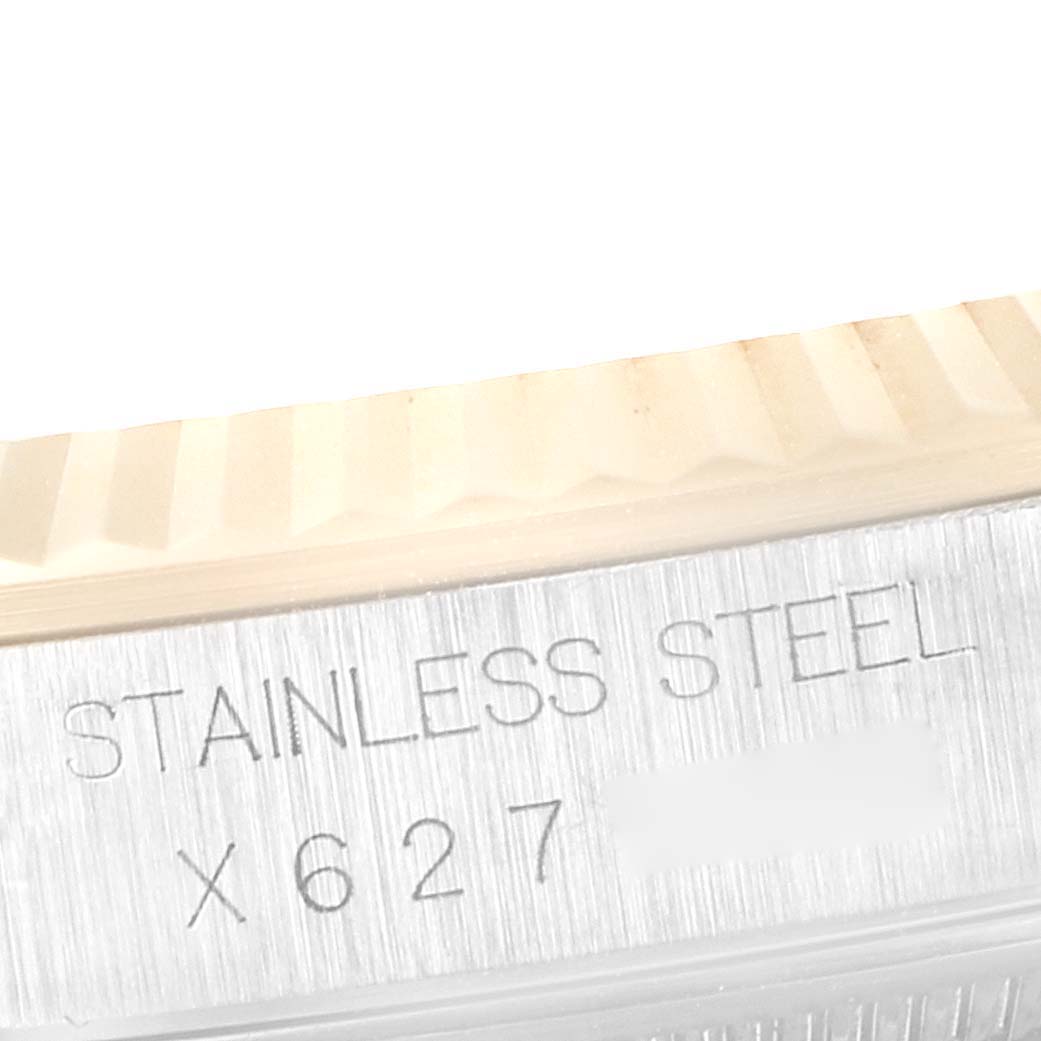 The image shows a close-up angled view of the stainless steel case and fluted bezel of a Rolex Datejust 16233 Men's Steel and Gold (two tone) Champagne Dial 16233 Men's Steel and Gold (two tone) Champagne Dial model.