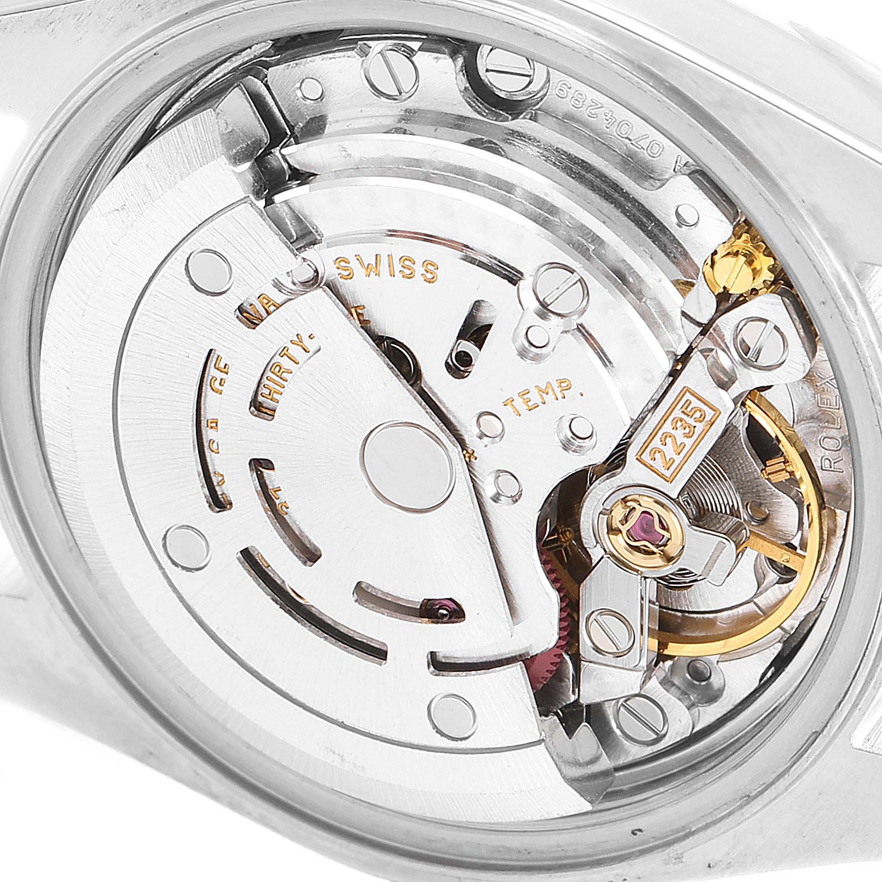 The image shows a close-up of the movement mechanism of a Rolex Datejust 79173 Women's Steel and Gold (two tone) Silver Dial 79173 Women's Steel and Gold (two tone) Silver Dial watch, highlighting its intricate components.