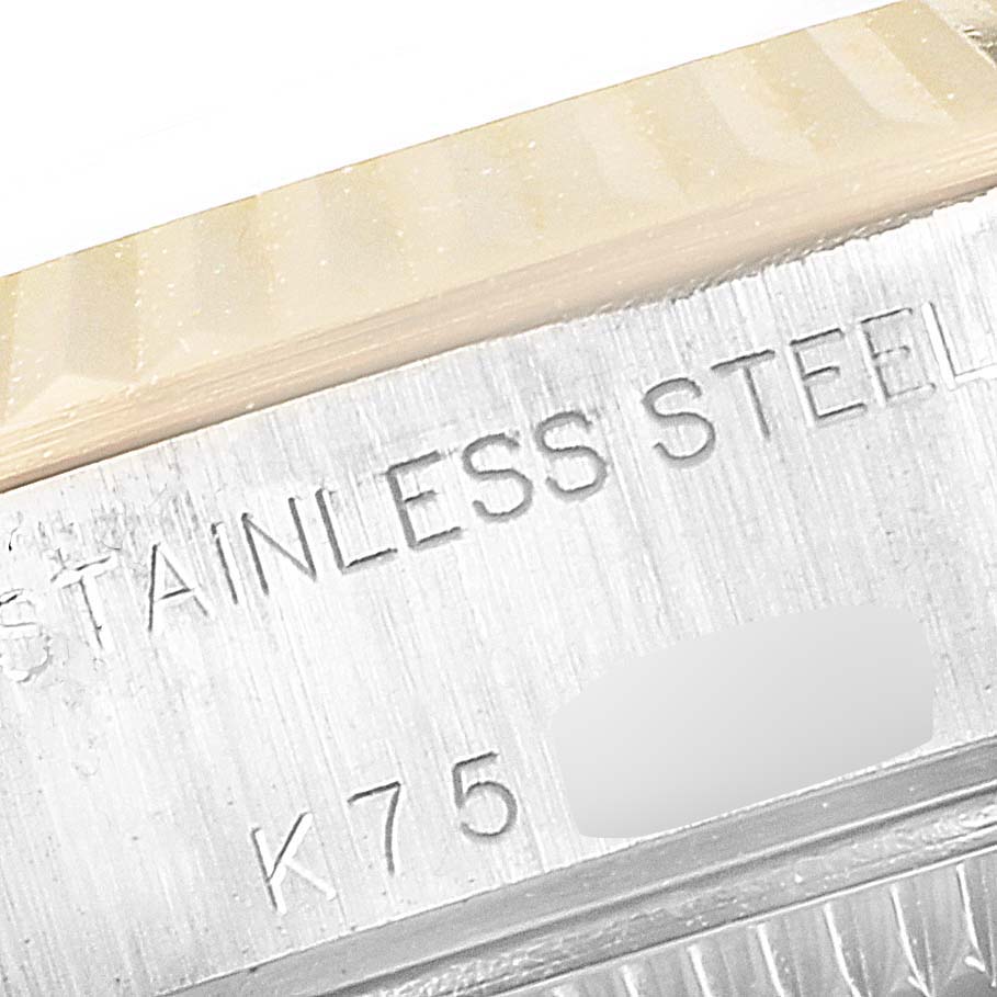 This image shows a close-up of the side of the casing, featuring "STAINLESS STEEL" inscription on a Rolex Datejust 79173 Women's Steel and Gold (two tone) Silver Dial 79173 Women's Steel and Gold (two tone) Silver Dial watch.