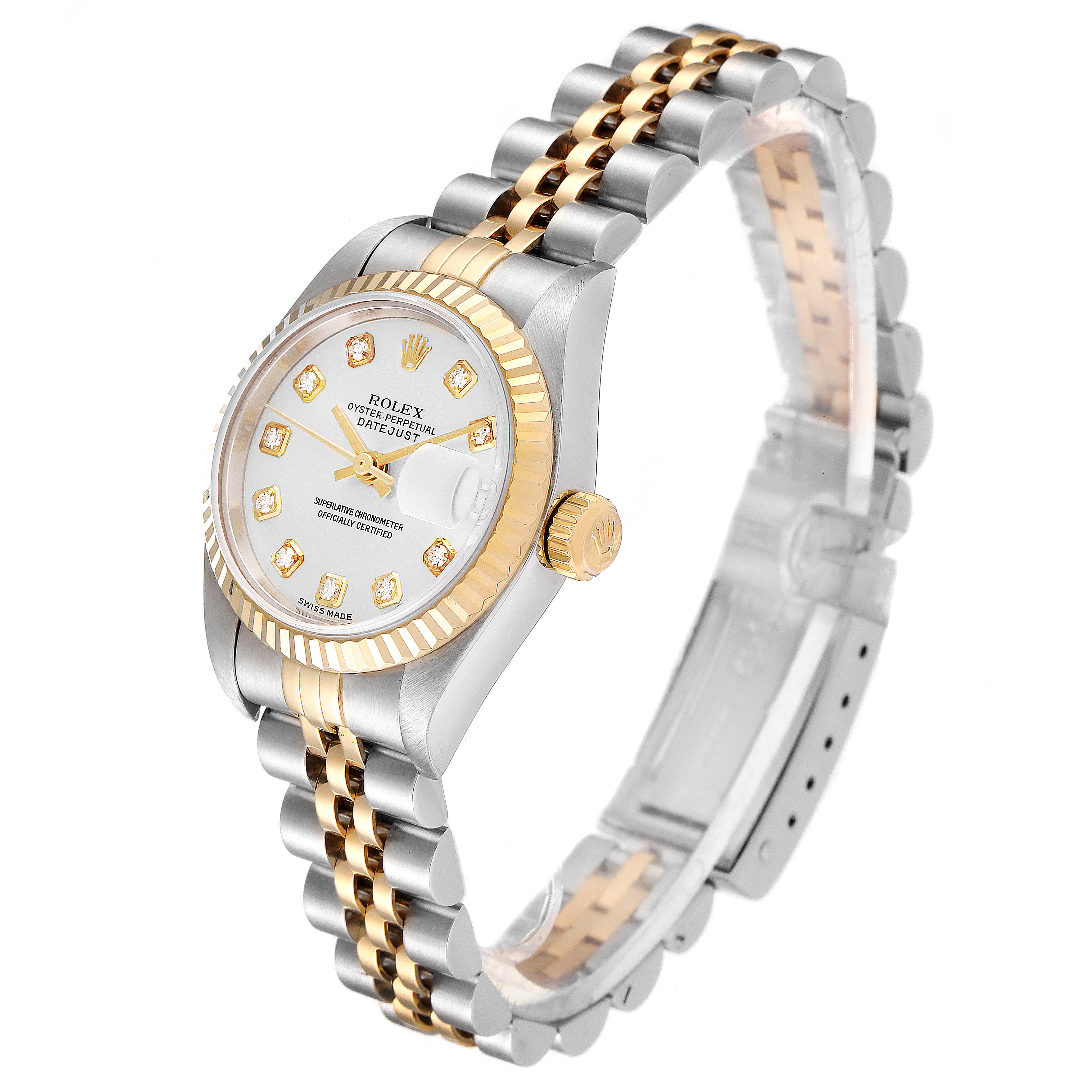The Rolex Datejust 79173 Women's Steel and Gold (two tone) Silver Dial 79173 Women's Steel and Gold (two tone) Silver Dial watch is shown from an angled side view, featuring its face, bezel, crown, and two-tone bracelet.