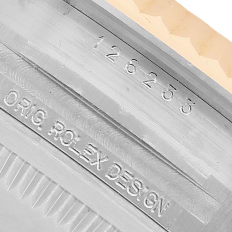The image shows a close-up of the serial and design number on the side of a Rolex Datejust 126233 Men's Steel and Gold (two tone) Mother of Pearl Dial watch case.