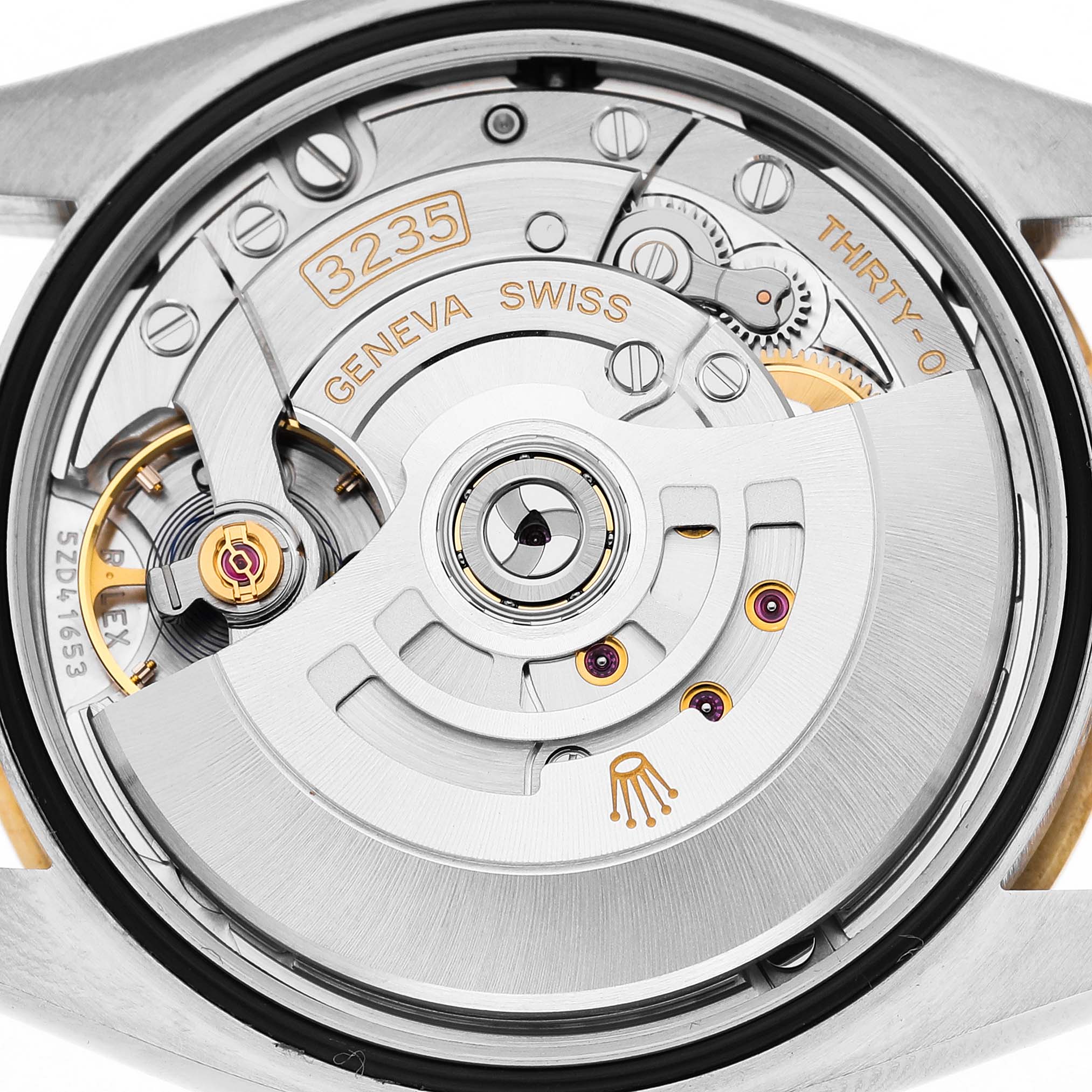 The image shows the movement of a Rolex Datejust 126233 Men's Steel and Gold (two tone) Mother of Pearl Dial watch from a back view, highlighting its intricate internal mechanics.