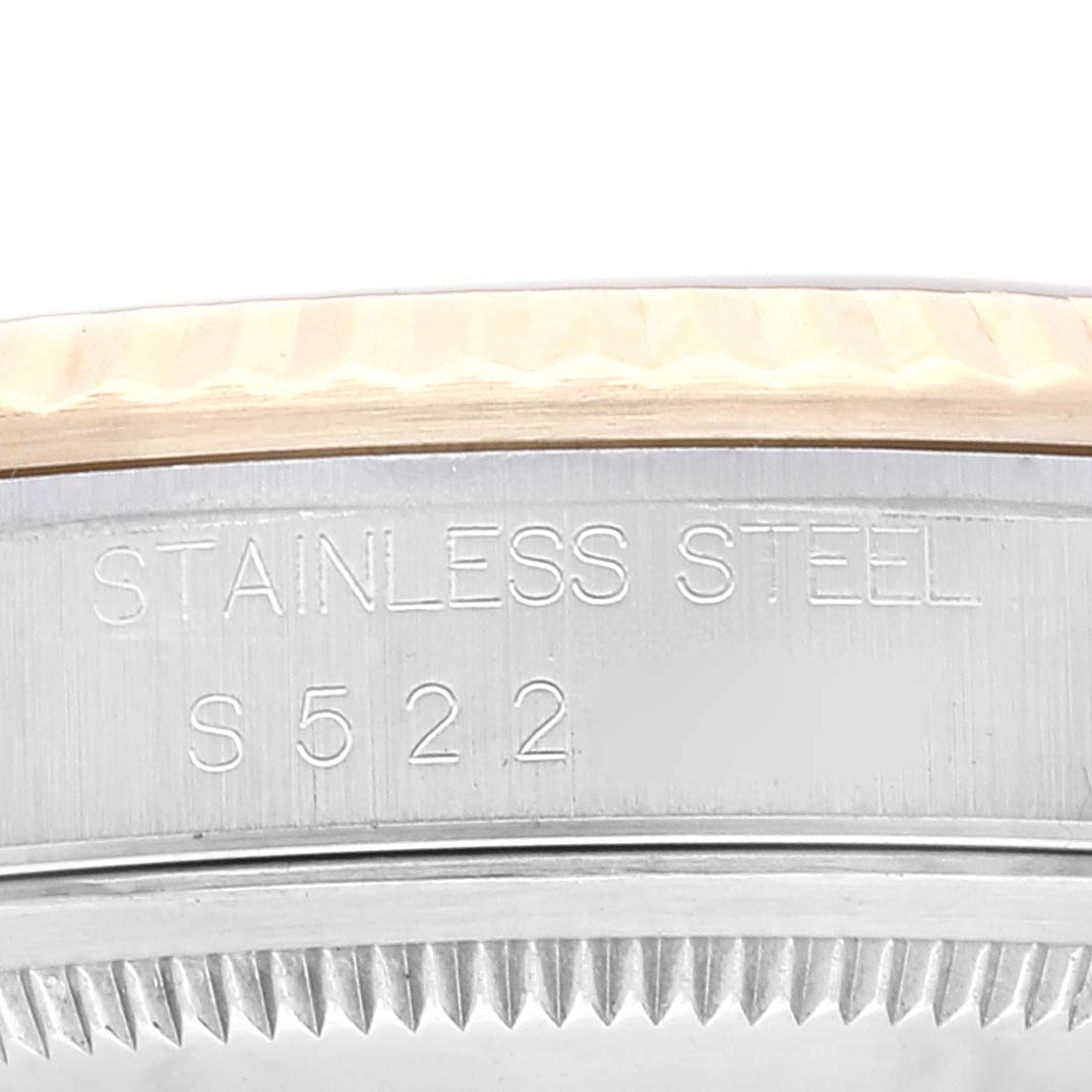 This image shows a close-up of the side of the case of a Rolex Datejust 16233 Men's Steel and Gold (two tone) Champagne Dial 16233 Men's Steel and Gold (two tone) Champagne Dial watch, highlighting the stainless steel markings and engravings.