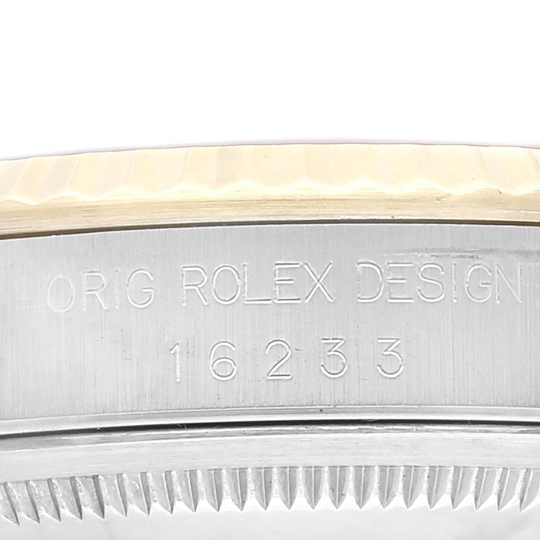 The image shows a close-up of the case side and the model number of a Rolex Datejust 16233 Men's Steel and Gold (two tone) Champagne Dial 16233 Men's Steel and Gold (two tone) Champagne Dial watch.