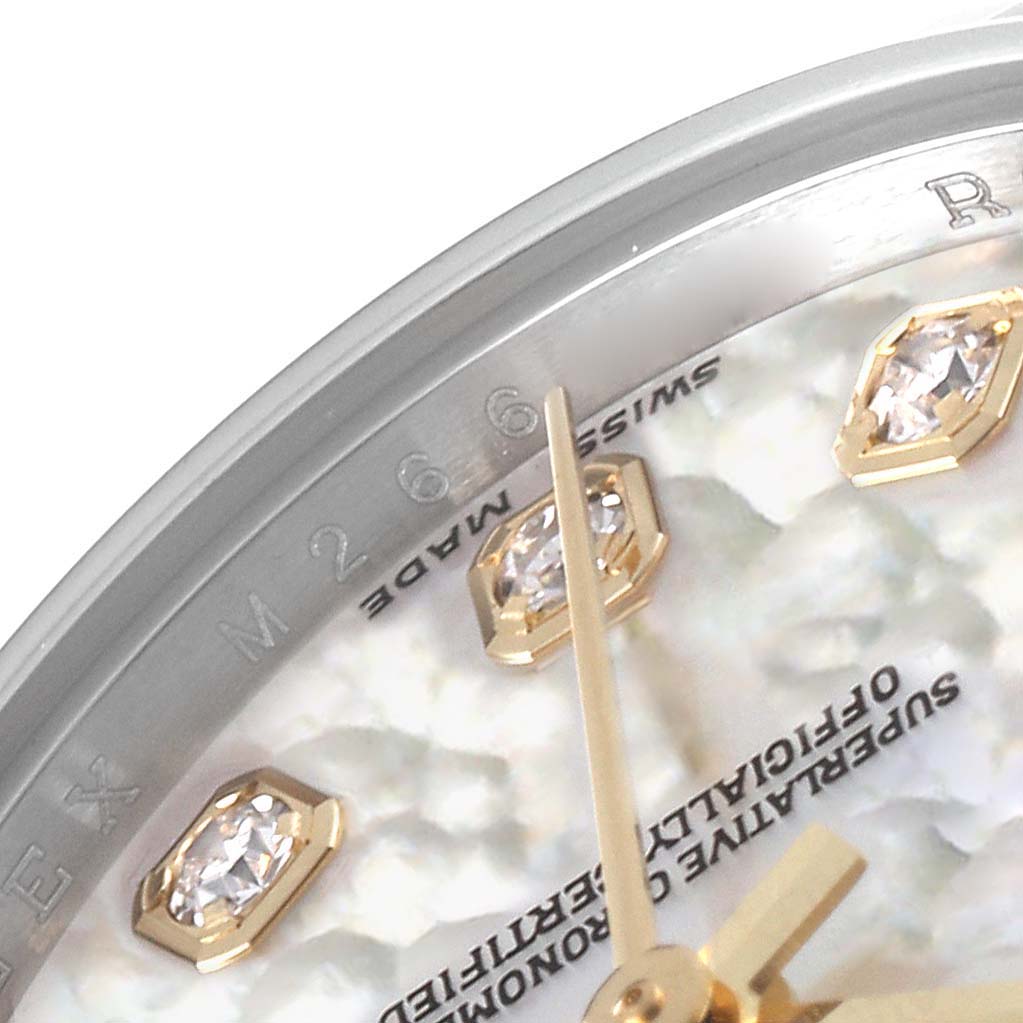 This image shows a close-up of the dial and bezel of a Rolex Datejust 179173 Women's Steel and Gold (two tone) Mother of Pearl Dial 179173 Women's Steel and Gold (two tone) Mother of Pearl Dial, focusing on the hour markers and minute hand.