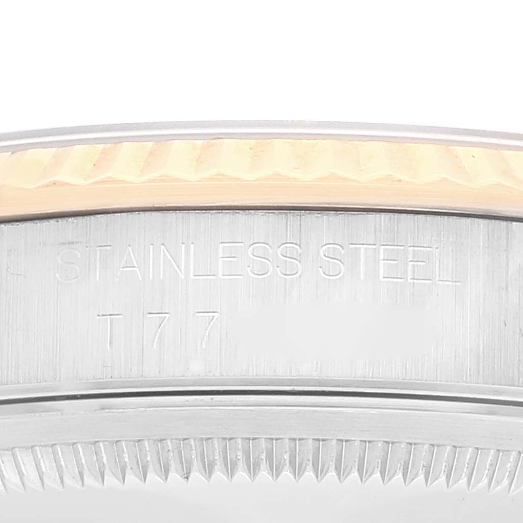 This close-up image of the Rolex Datejust 16233 Men
s Steel and Gold (two tone) Grey Dial 16233 Men
s Steel and Gold (two tone) Grey Dial shows the side of the case, revealing the "STAINLESS STEEL" engraving.