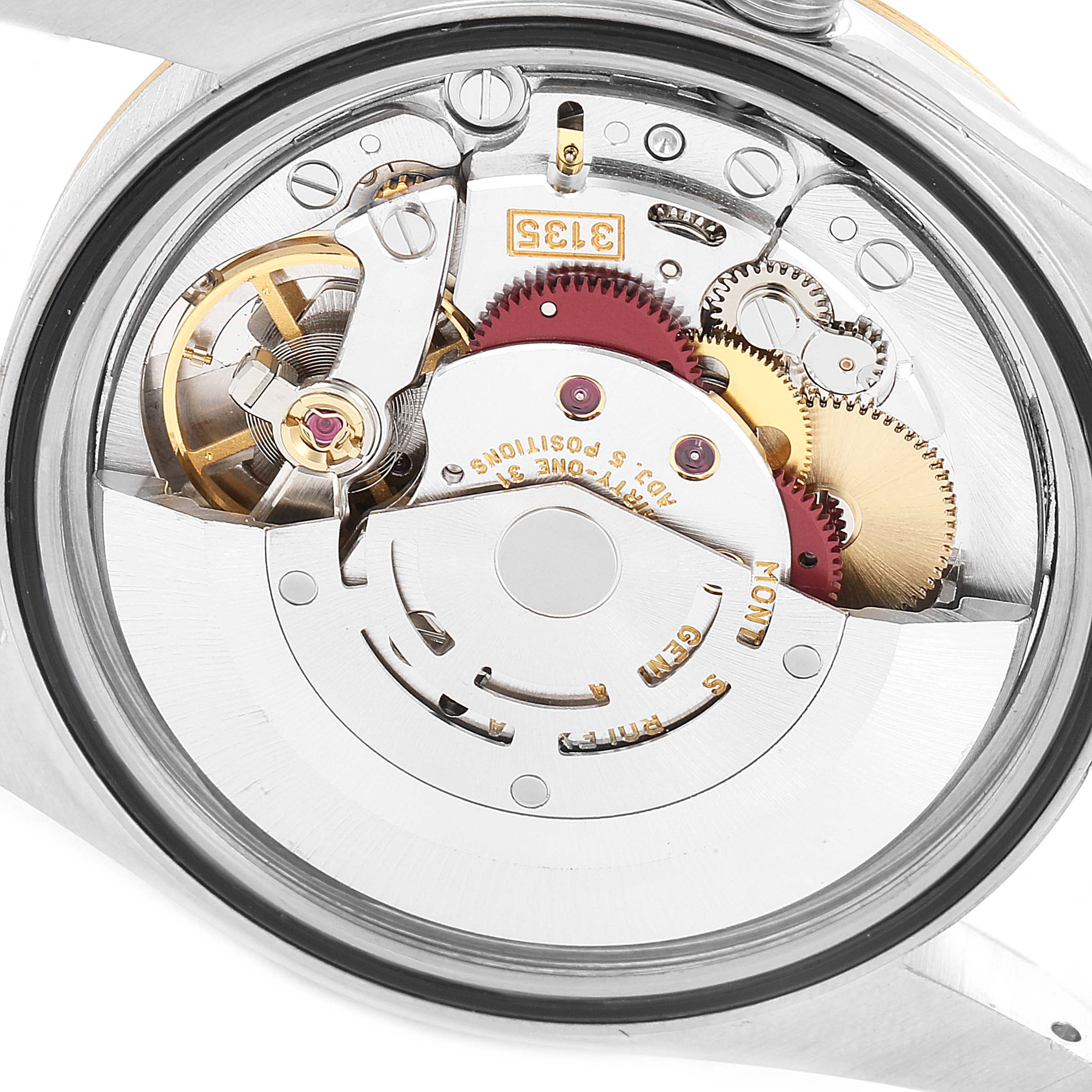 This image shows the movement, internal mechanics, and gears of a Rolex Datejust 16233 Men's Steel and Gold (two tone) White Dial 16233 Men's Steel and Gold (two tone) White Dial watch from a rear perspective.