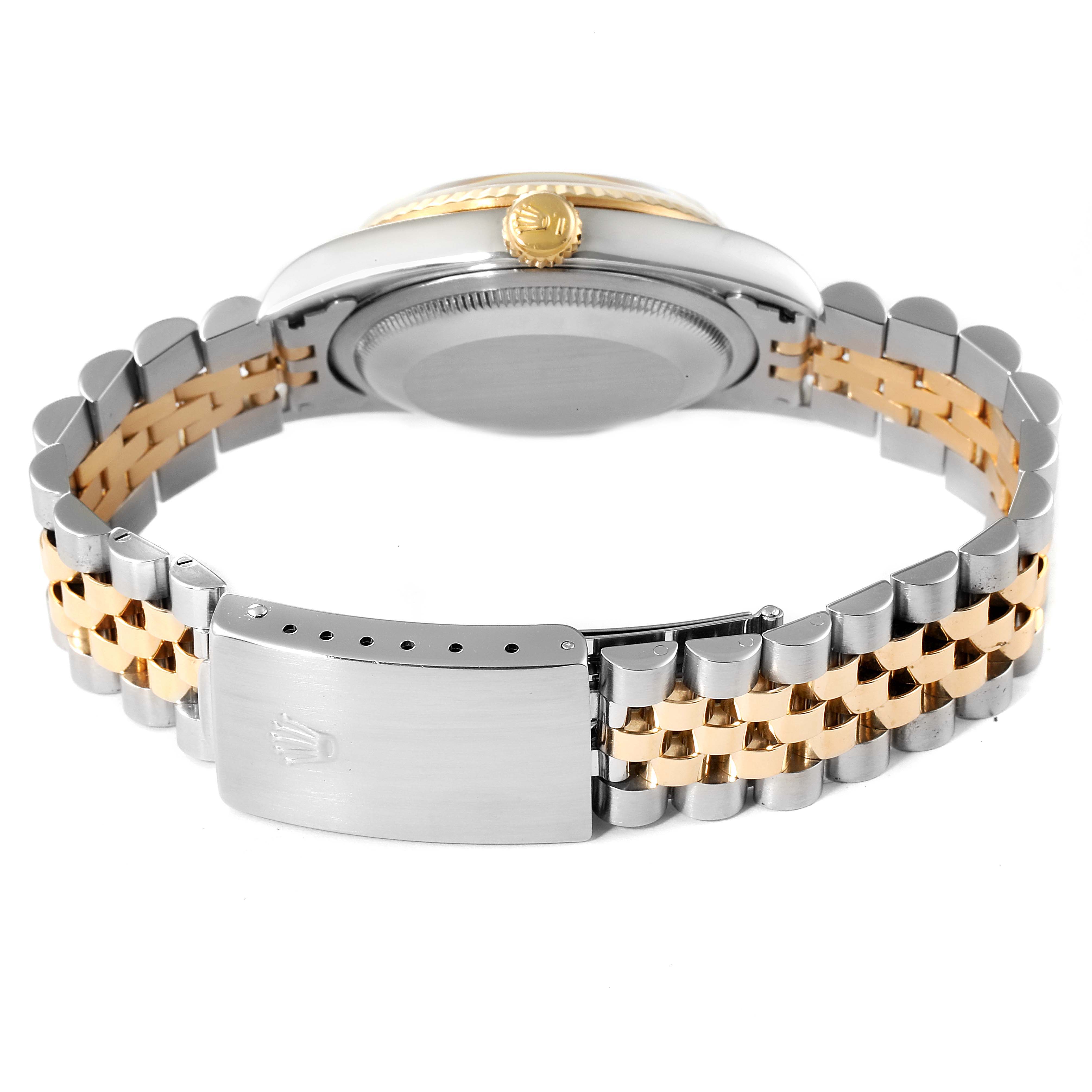 The image shows the backside of a Rolex Datejust 16233 Men's Steel and Gold (two tone) White Dial 16233 Men's Steel and Gold (two tone) White Dial watch, focusing on the caseback, winding crown, and two-tone jubilee bracelet.