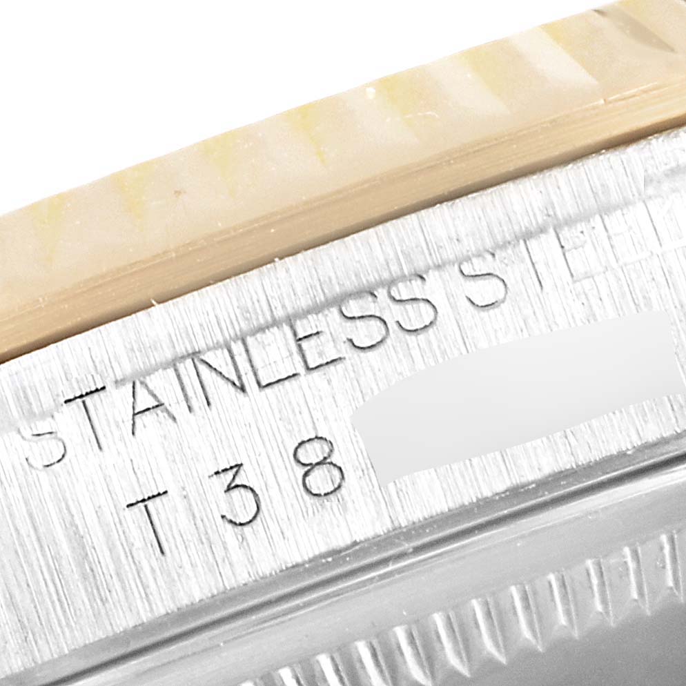 This close-up image of a Rolex Datejust 16233 Men's Steel and Gold (two tone) White Dial 16233 Men's Steel and Gold (two tone) White Dial model shows the engraving on the stainless steel part of the watch case.