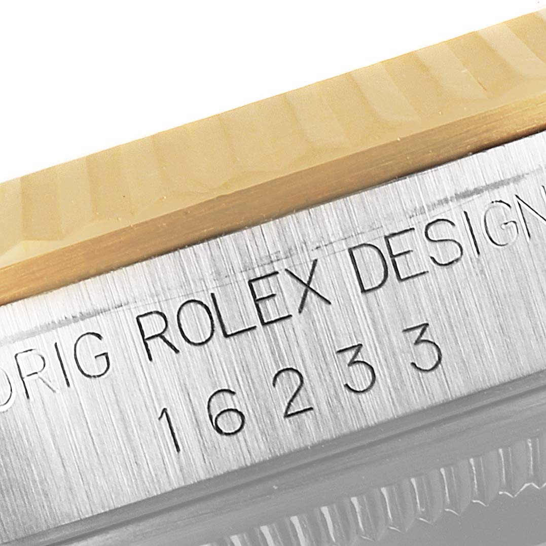 The close-up image shows the Rolex branding and model number "16233" engraved on the watch case of a Rolex Datejust 16233 Men's Steel and Gold (two tone) White Dial 16233 Men's Steel and Gold (two tone) White Dial model.