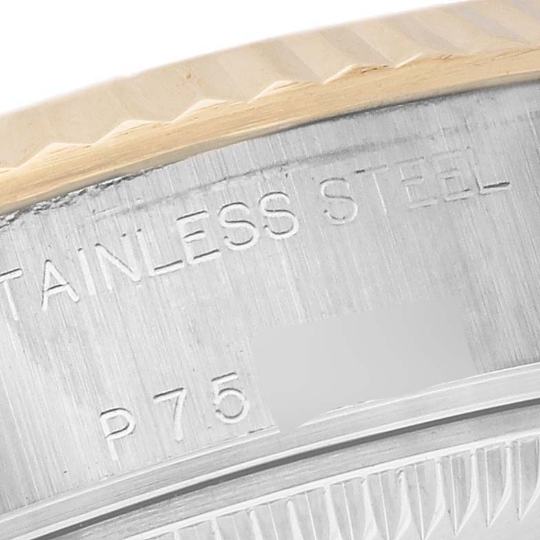 This image shows a close-up of the engravings on the bezel and case of a Rolex Datejust 79173 Women's Steel and Gold (two tone) White Dial 79173 Women's Steel and Gold (two tone) White Dial watch.