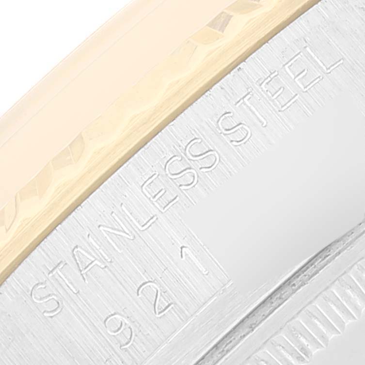 The image shows an angled close-up of the bezel and case of a Rolex Vintage Collection 16013 Men's Steel and Gold (two tone) White Dial 16013 Men's Steel and Gold (two tone) White Dial watch, highlighting its stainless steel composition.